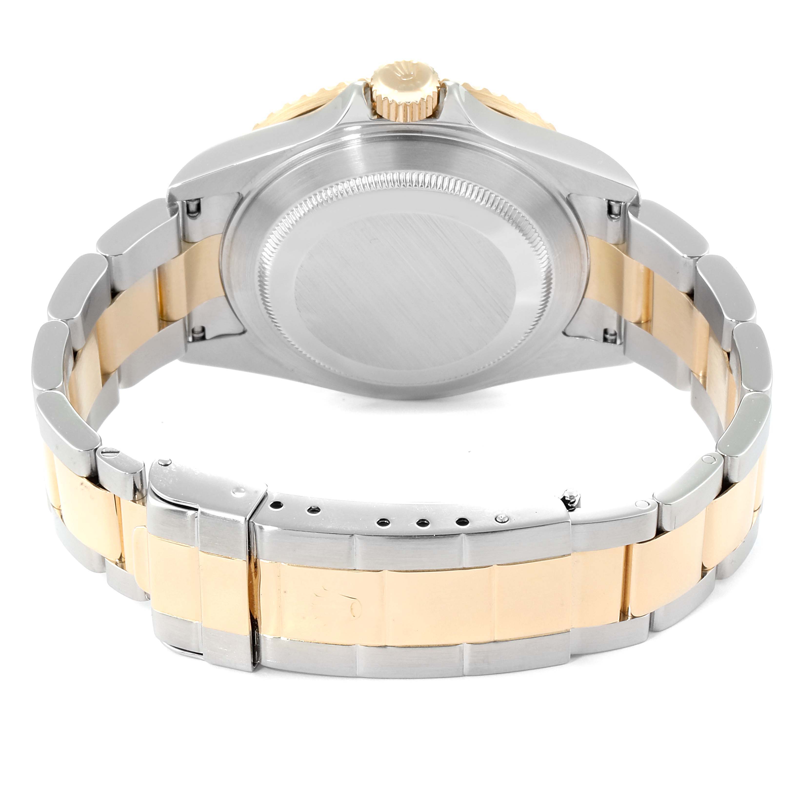 This image shows the back, bracelet, and clasp of a Rolex Submariner 16613 Men's Steel and Gold (two tone) Black Dial 16613 Men's Steel and Gold (two tone) Black Dial watch.