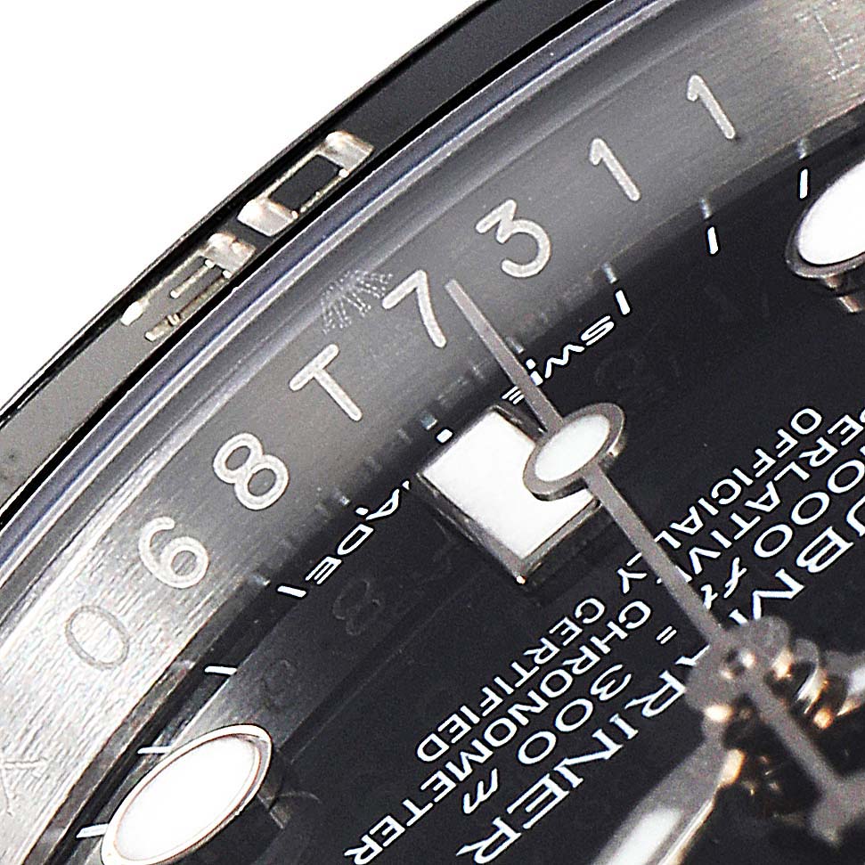 The image shows a close-up of the dial and bezel of a Rolex Submariner 114060 Men
s Stainless Steel Black Dial 114060 Men
s Stainless Steel Black Dial watch, focusing on the numerals and watch hands.