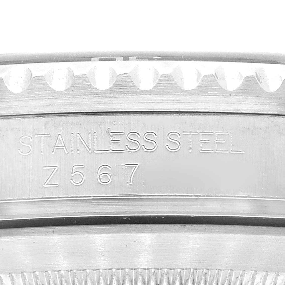 The image shows a close-up view of the side of a Rolex Submariner 16610 Men
s Stainless Steel Black Dial 16610 Men
s Stainless Steel Black Dial watch, focusing on the bezel and engraving.