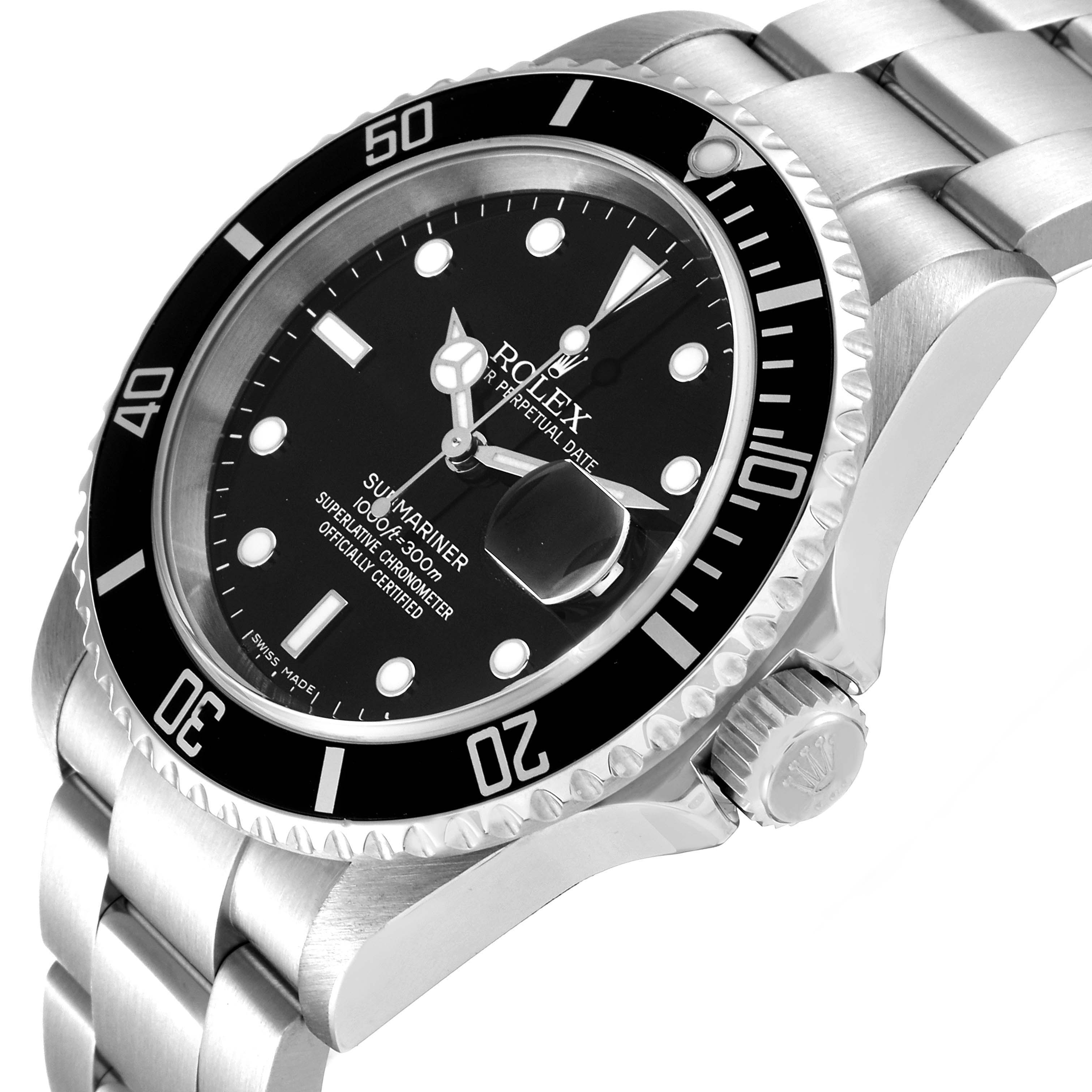 The image shows a close-up of the Rolex Submariner 16610 Men
s Stainless Steel Black Dial 16610 Men
s Stainless Steel Black Dial watch face and part of the bracelet at a slight angle from the top left side.