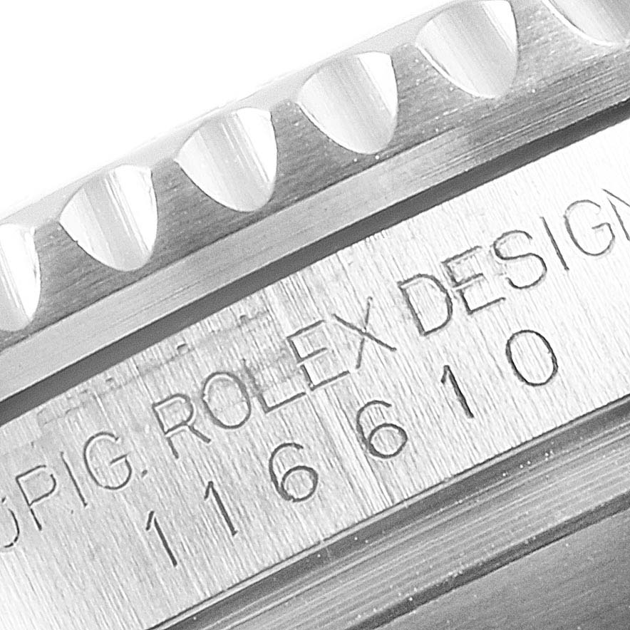 This image shows a close-up of the engraved serial number on the side of a Rolex Submariner 116610LV Men's Stainless Steel Green Dial 116610LV Men's Stainless Steel Green Dial watch case.