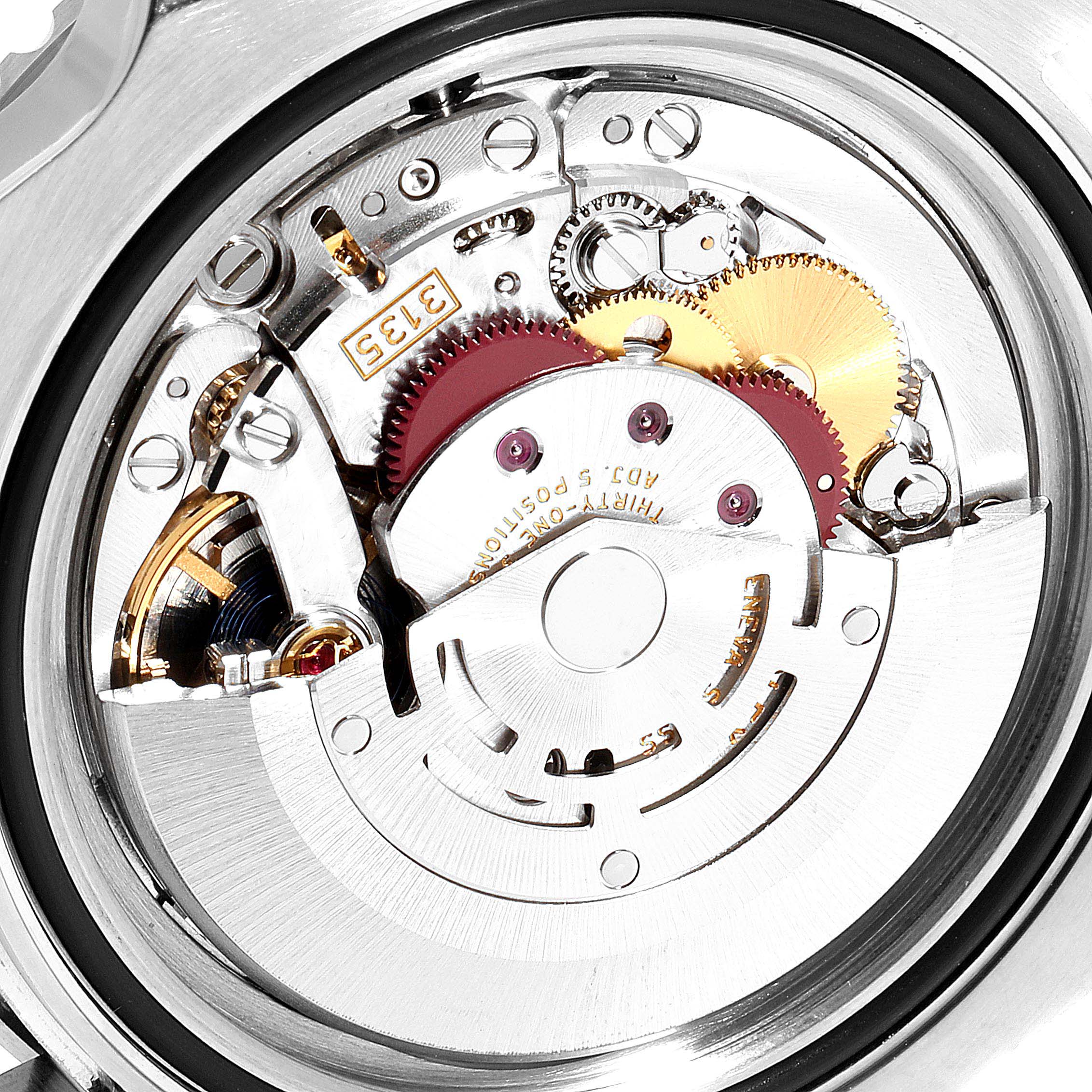 This is a close-up view of the movement mechanism inside a Rolex Submariner 116610LV Men's Stainless Steel Green Dial 116610LV Men's Stainless Steel Green Dial watch.