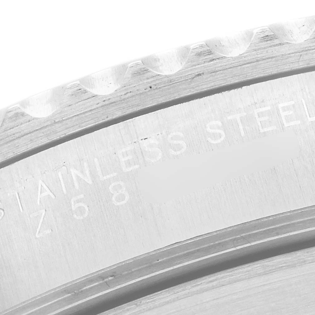 The image shows a close-up of the stainless steel bezel and engraved case markings of a Rolex Submariner 14060 Men
s Stainless Steel Black Dial 14060 Men
s Stainless Steel Black Dial watch.