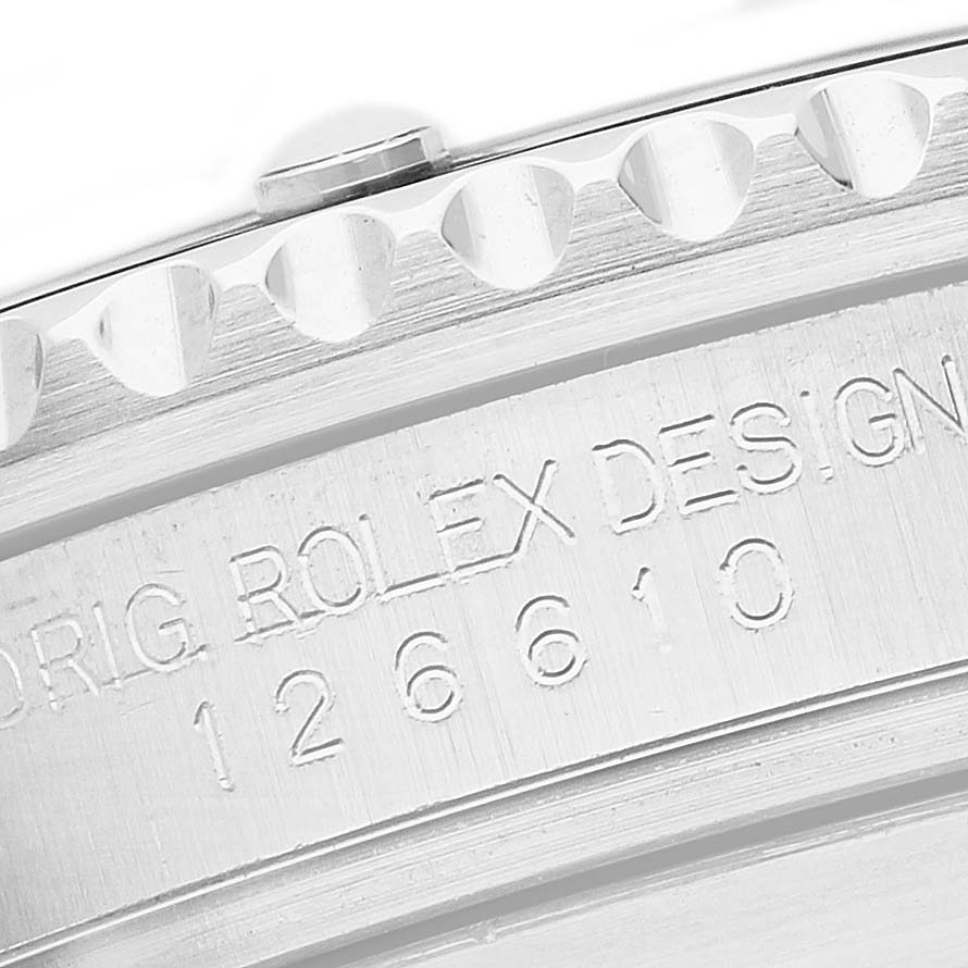 The image shows a close-up angle of the side of a Rolex Submariner 126610 Men's Stainless Steel Black Dial, highlighting the engraved model number and bezel edge.