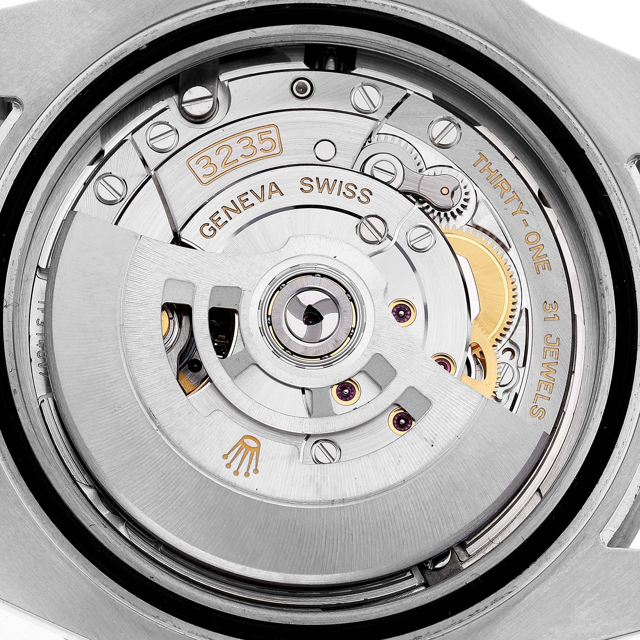 The image shows a close-up of a Rolex Submariner 126610 Men's Stainless Steel Black Dial's movement, highlighting its intricate internal mechanisms and rotor.
