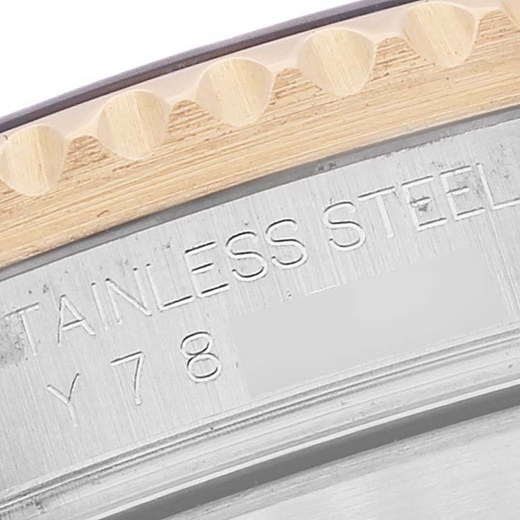 This close-up image shows the detailed engraving and edge of the bezel on the Rolex Submariner 16613 Men's Steel and Gold (two tone) Grey Dial 16613 Men's Steel and Gold (two tone) Grey Dial watch.