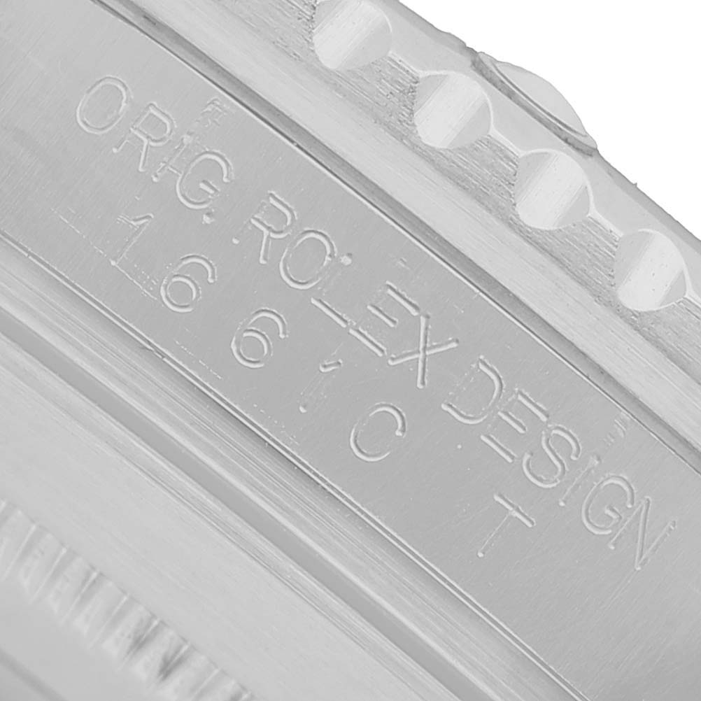 The image shows the engraving on the side of the bezel of a Rolex Submariner 16610LV Men's Stainless Steel Black Dial, highlighting the model details.