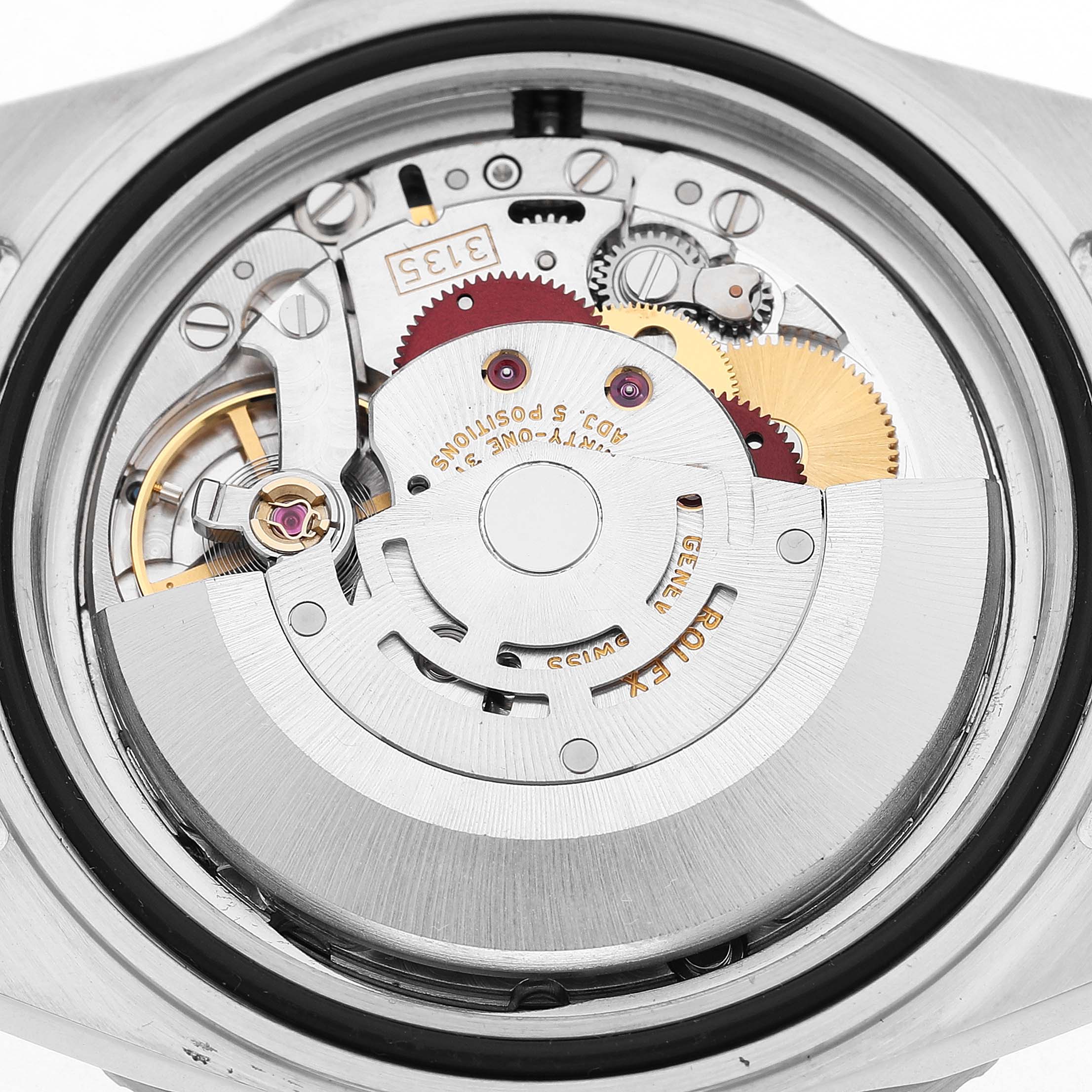 The image shows the movement of a Rolex Submariner 16610LV Men's Stainless Steel Black Dial, viewed from the back, revealing gears and components inside.