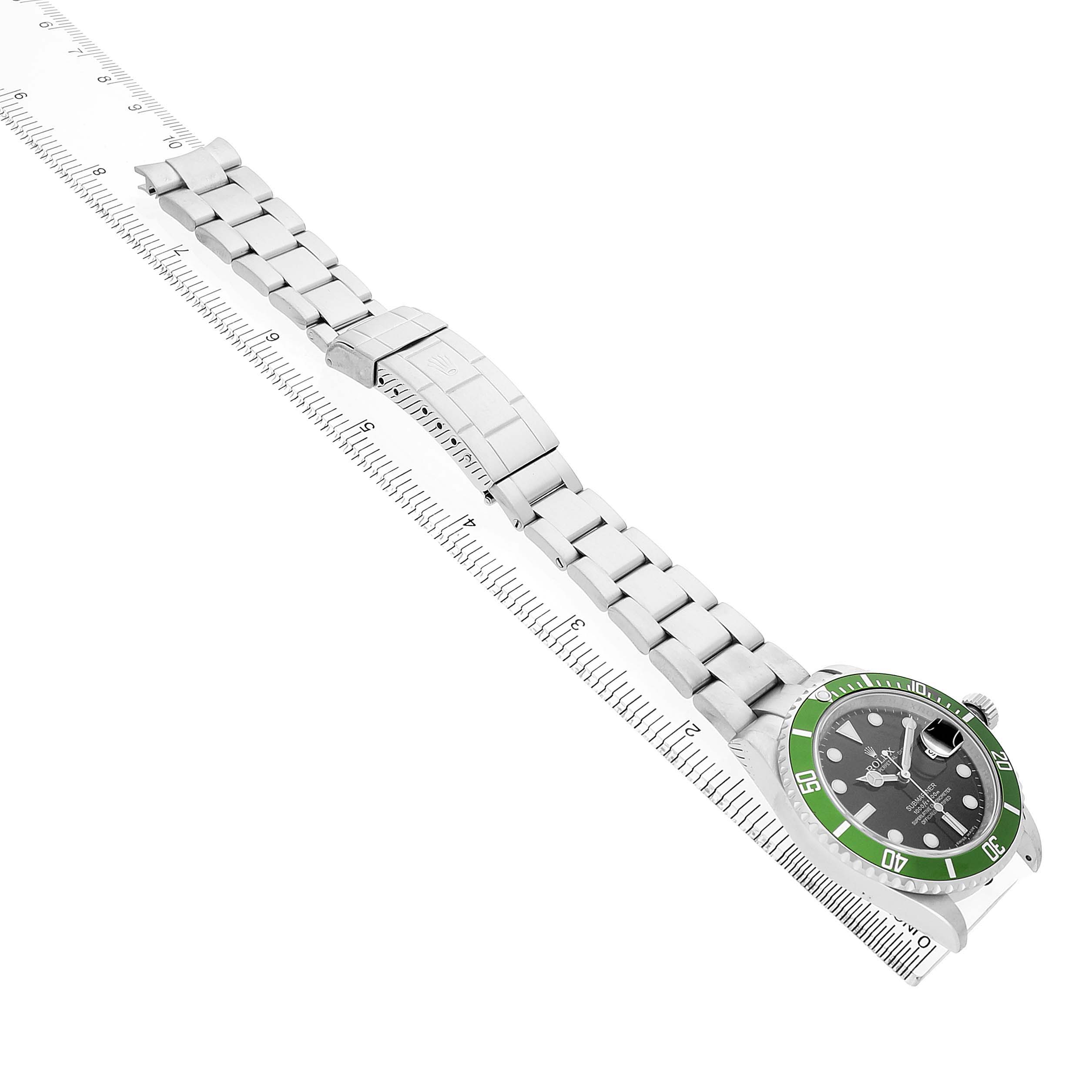 The Rolex Submariner 16610LV Men's Stainless Steel Black Dial watch is viewed from an angled overhead perspective, showing the bracelet and bezel, with a green bezel accent.