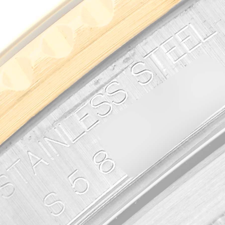 The image shows a close-up of the side engraving on a Rolex Submariner 16613 Men's Steel and Gold (two tone) Blue Dial 16613 Men's Steel and Gold (two tone) Blue Dial watch, highlighting the "STAINLESS STEEL" inscription.