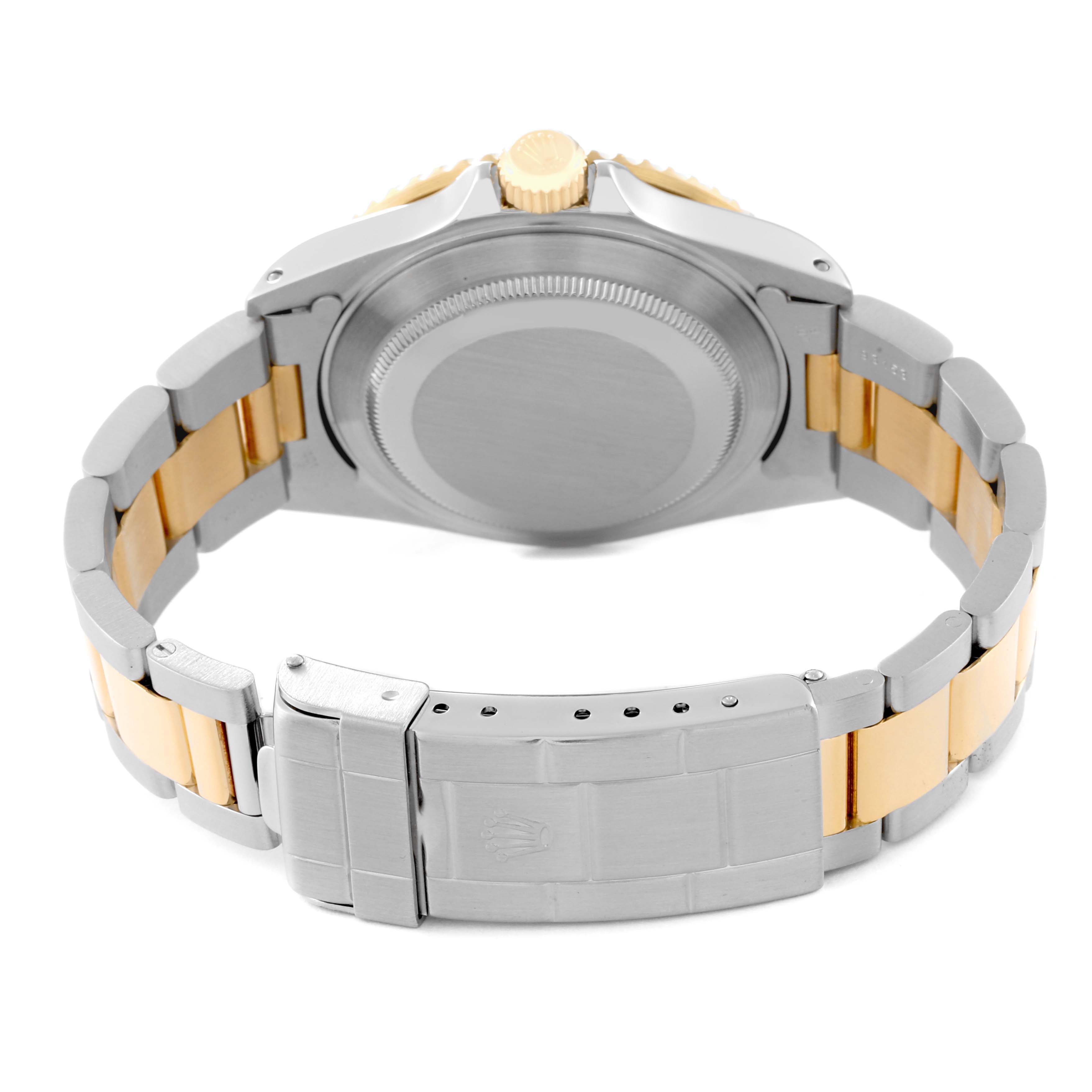 The image shows the back view of the Rolex Submariner 16613 Men's Steel and Gold (two tone) Blue Dial 16613 Men's Steel and Gold (two tone) Blue Dial watch, highlighting the case back, bracelet, and clasp.