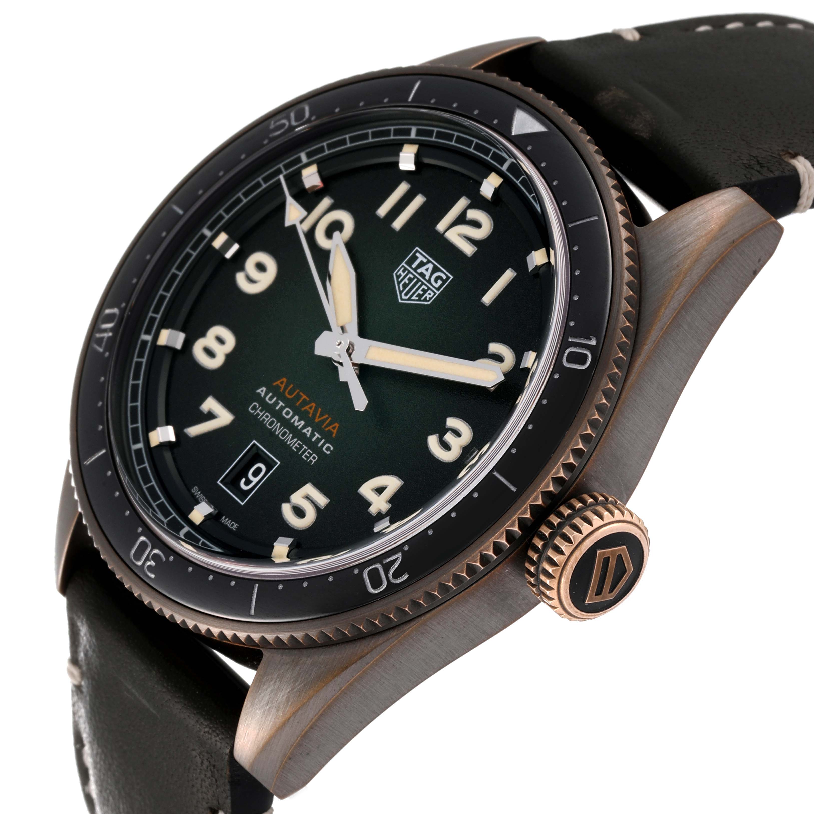 The image shows a side view of the Tag Heuer Autavia WBE5190.FC8268 Men's Bronze Green Dial WBE5190.FC8268 Men's Bronze Green Dial watch, highlighting its dial, bezel, crown, and part of the strap.
