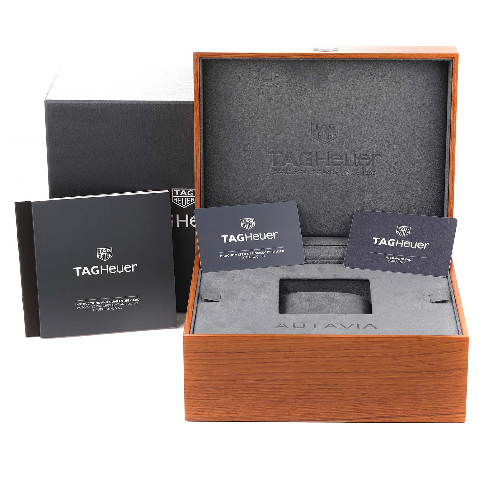 The image shows the packaging, instruction manual, warranty cards, and inner box for the Tag Heuer Autavia WBE5190.FC8268 Men's Bronze Green Dial WBE5190.FC8268 Men's Bronze Green Dial model watch.
