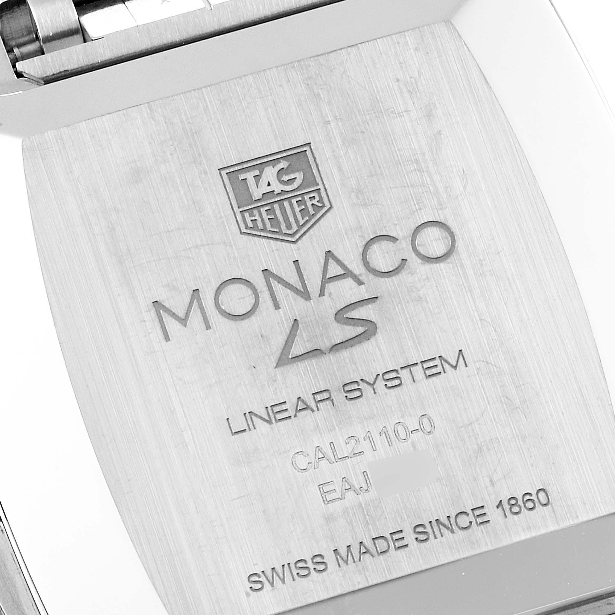 The image shows the back case and branding details of a Tag Heuer Monaco CAL2110.BA0781 Men's Stainless Steel Black Dial CAL2110.BA0781 Men's Stainless Steel Black Dial watch.