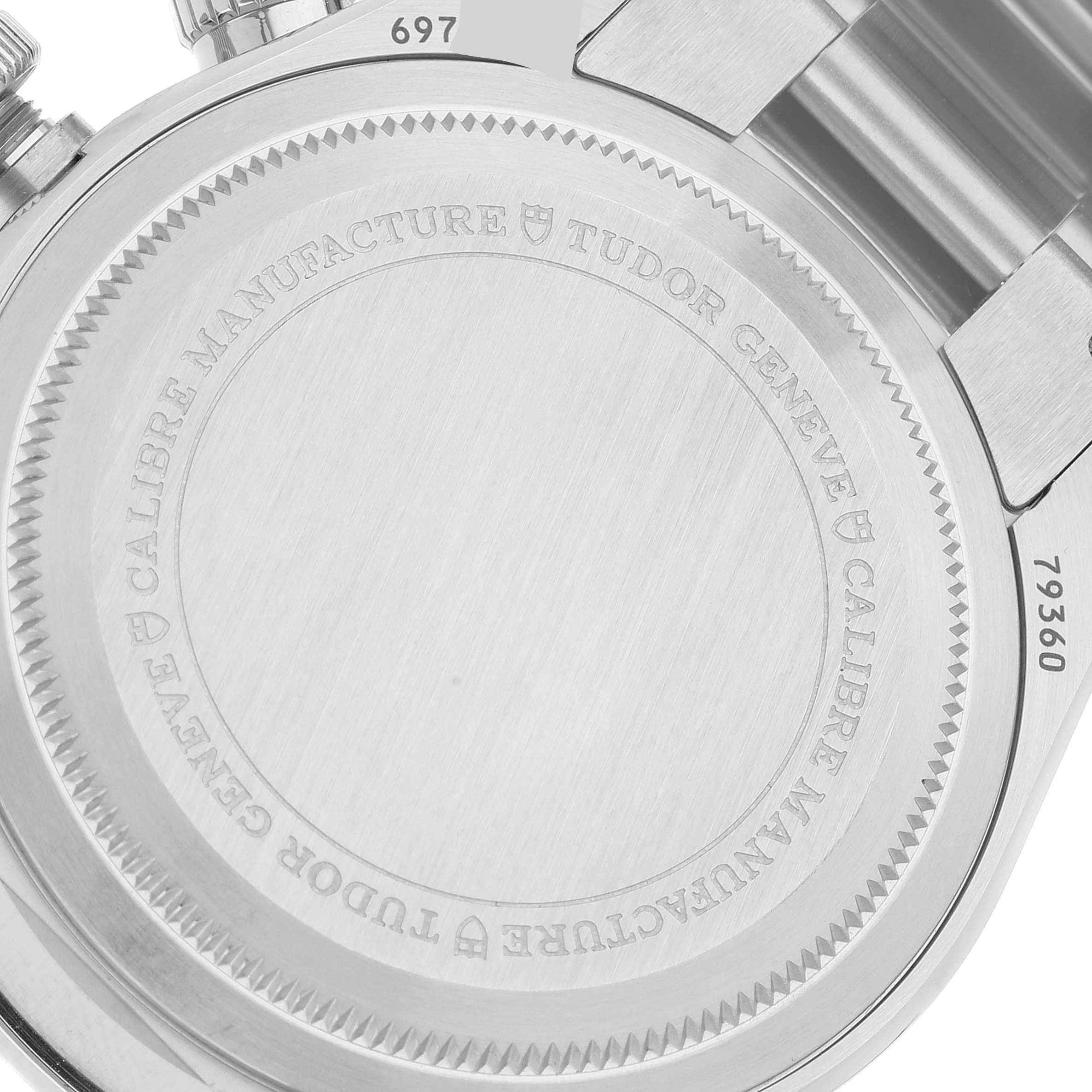 This image shows the back case of a Tudor Heritage Chrono M79360N-0002 Men's Stainless Steel Silver Dial M79360N-0002 Men's Stainless Steel Silver Dial watch, highlighting its model engravings and stainless steel texture.