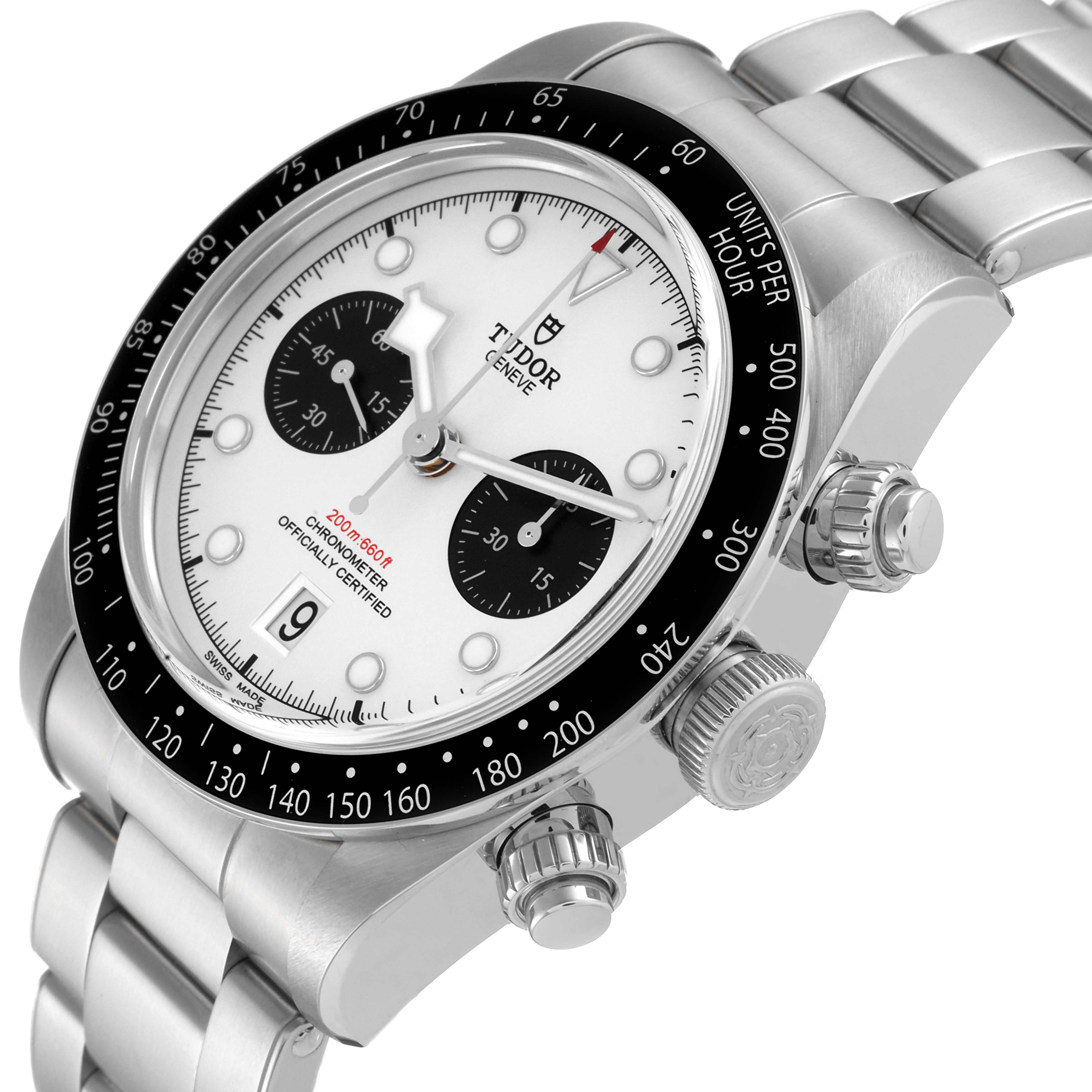 The image shows a close-up of the Tudor Heritage Chrono M79360N-0002 Men's Stainless Steel Silver Dial M79360N-0002 Men's Stainless Steel Silver Dial watch's face, bezel, and crown from an angled side view.