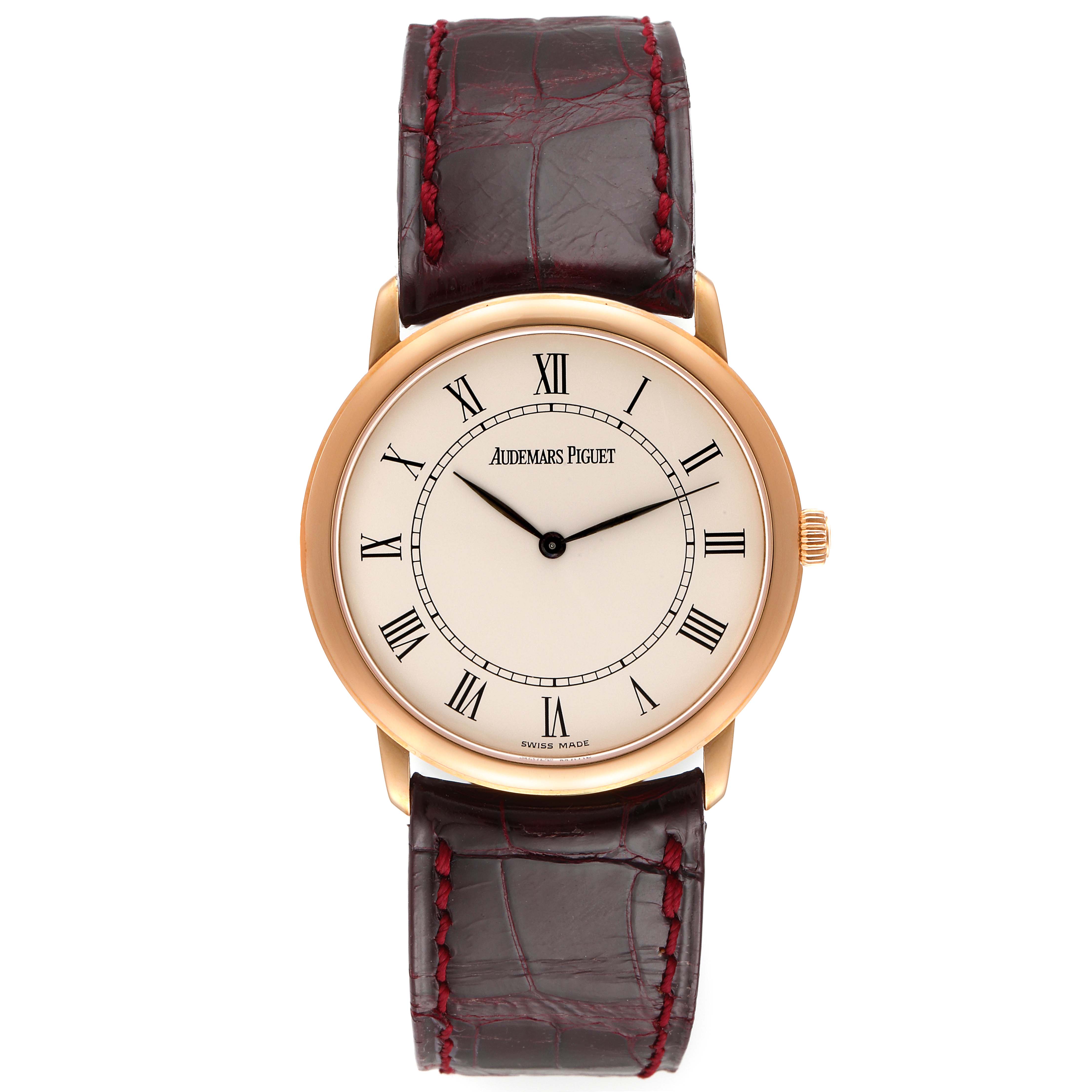 The Jules model by Audemars Piguet is shown from a top-down angle, displaying the watch face, brown leather strap, and gold case.