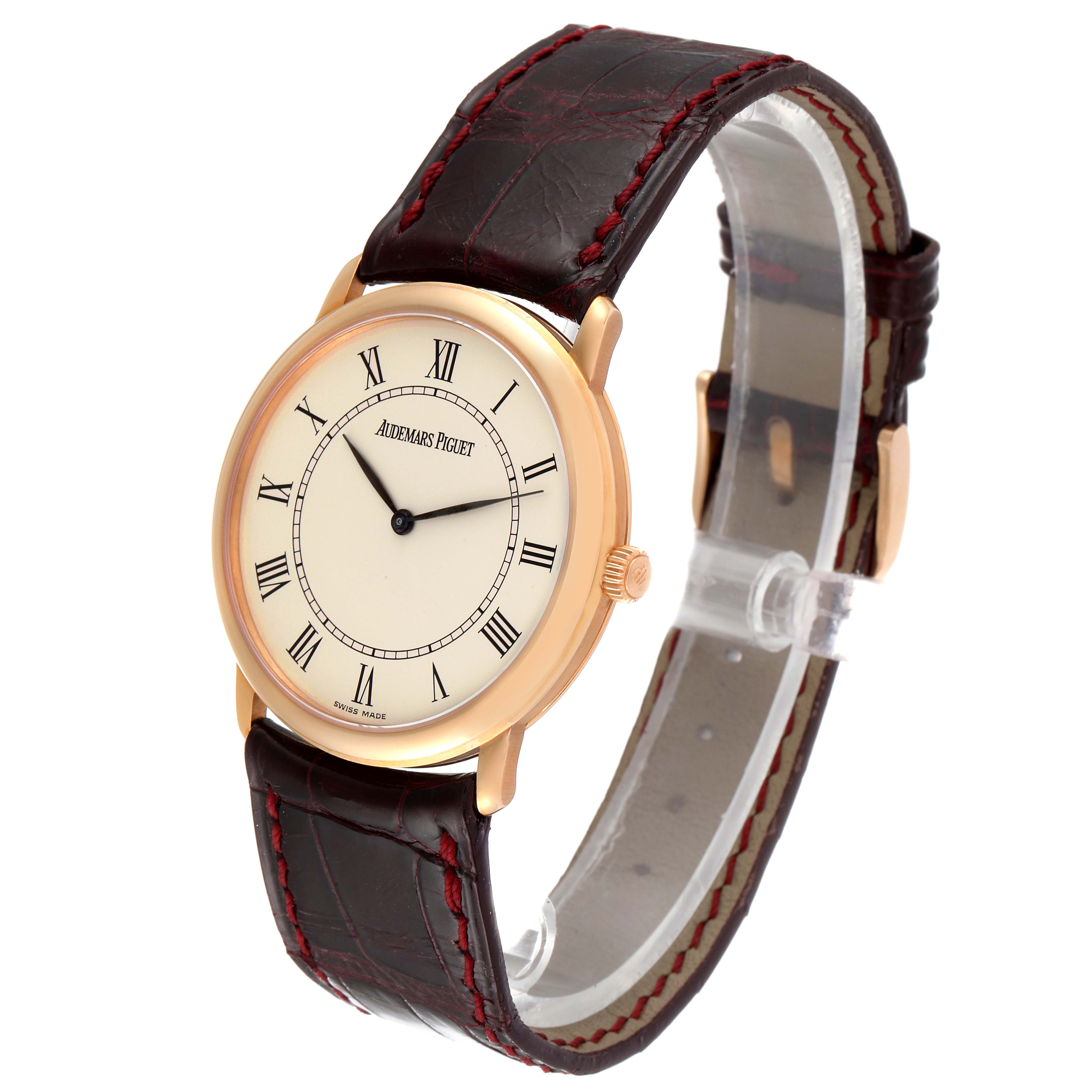 The Jules model by Audemars Piguet is shown at a three-quarter angle, highlighting the watch face, case, and leather strap with stitching.