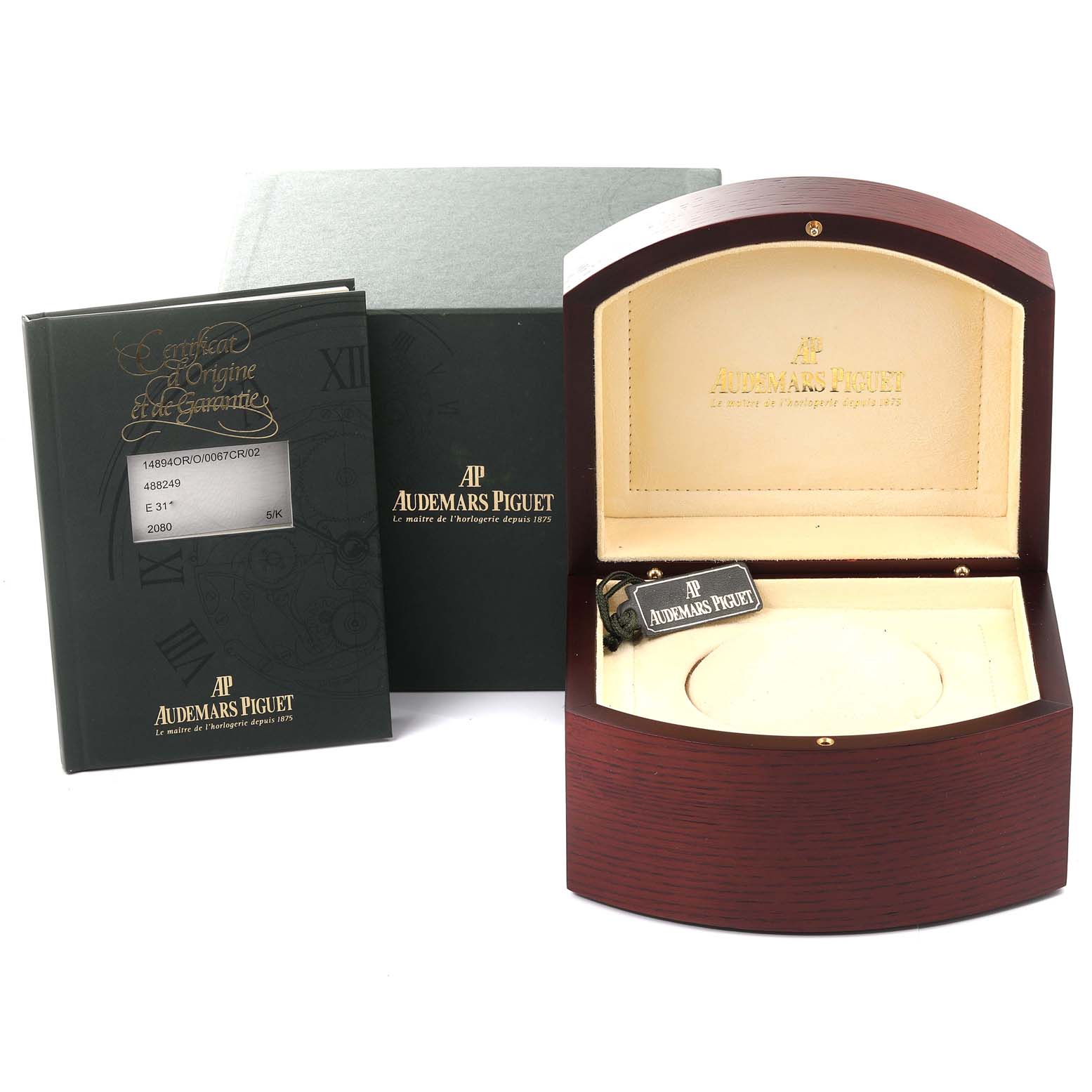 The image shows the packaging, tag, manuals, and empty display box for a Jules model by Audemars Piguet.