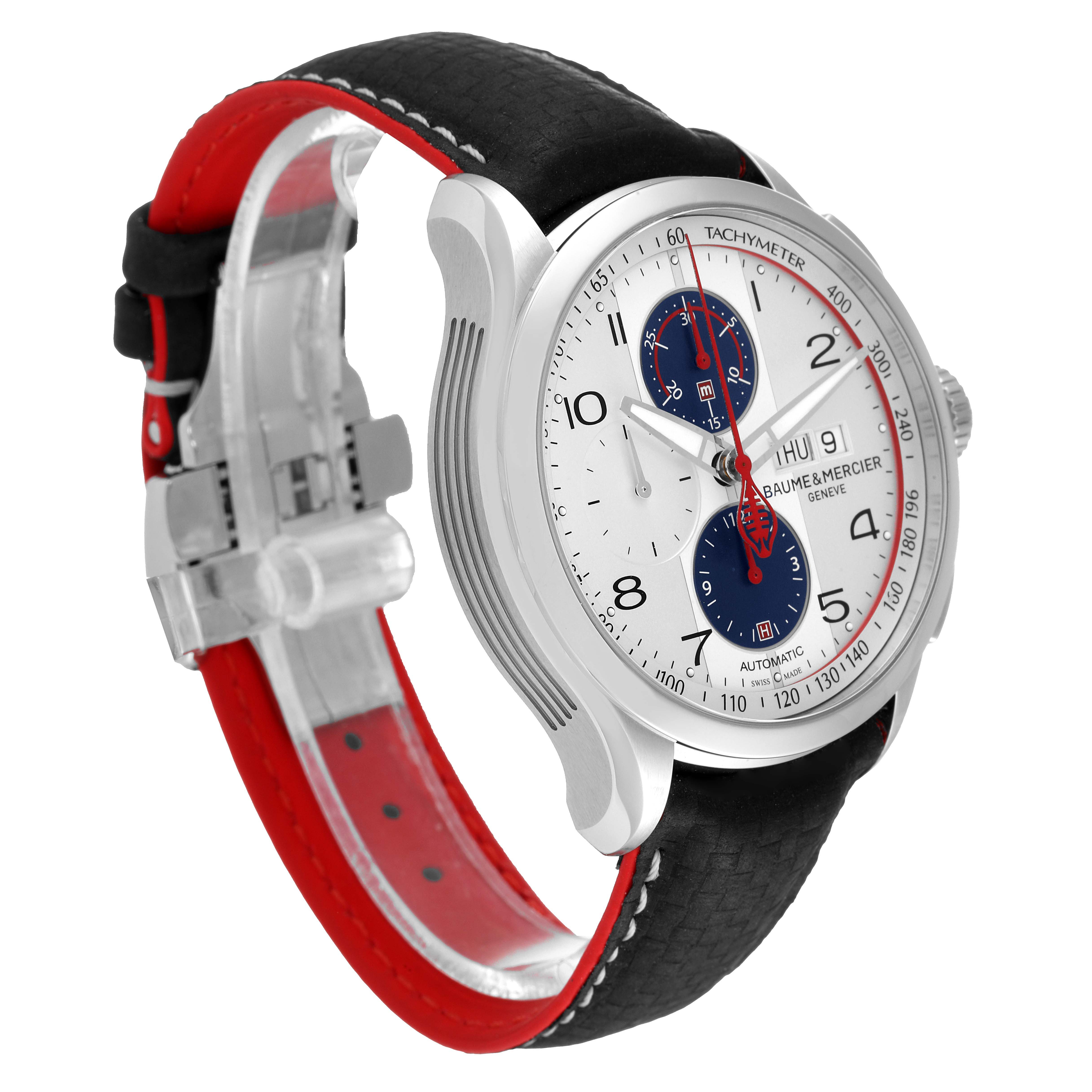 The Baume & Mercier Clifton M0A10342 Men's Stainless Steel Silver Dial M0A10342 Men's Stainless Steel Silver Dial watch is shown at a 3/4 angle highlighting its face, silver case, black and red leather strap, and clasp.