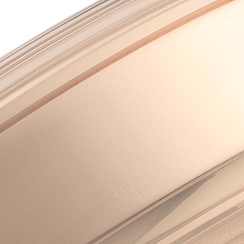 This image shows a close-up of the side casing of the Breitling Transocean RB0510 Men's Rose Gold Blue Dial RB0510 Men's Rose Gold Blue Dial watch.