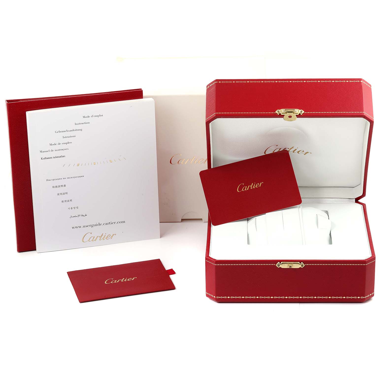 The image shows packaging, warranty card, manual, and presentation box for a Calibre de Cartier watch by Cartier.