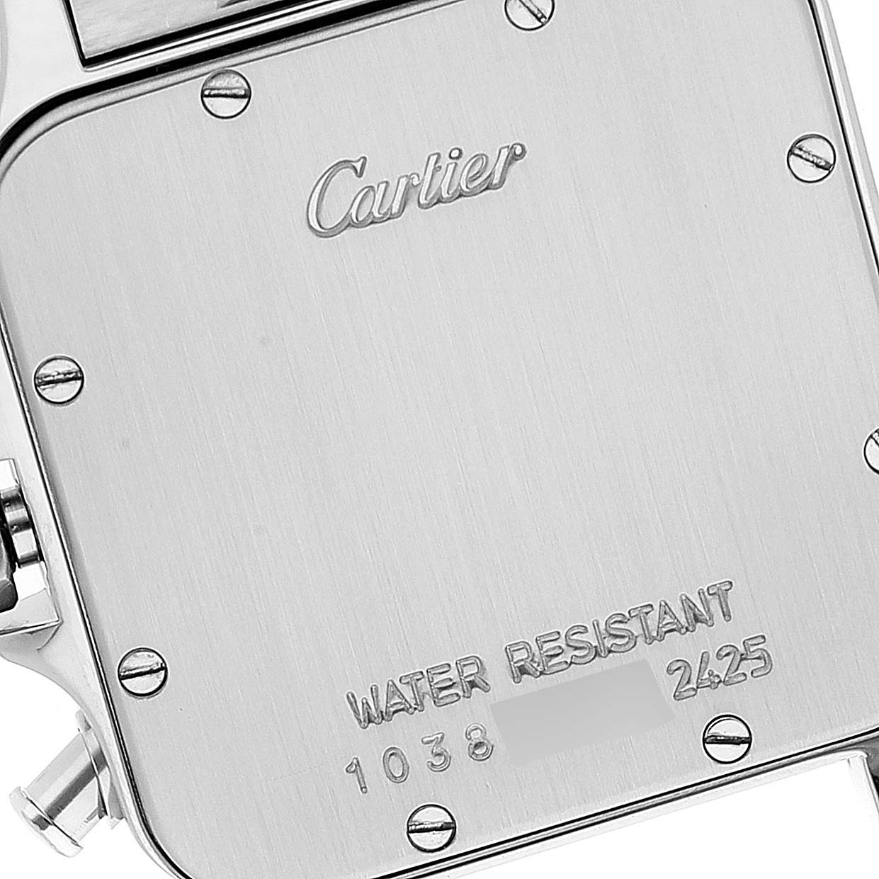 This is a close-up of the back case of a Cartier Santos W20042C4 Men's Steel and Gold (two tone) Silver Dial W20042C4 Men's Steel and Gold (two tone) Silver Dial watch, showing the Cartier logo, screw details, and water resistance information.