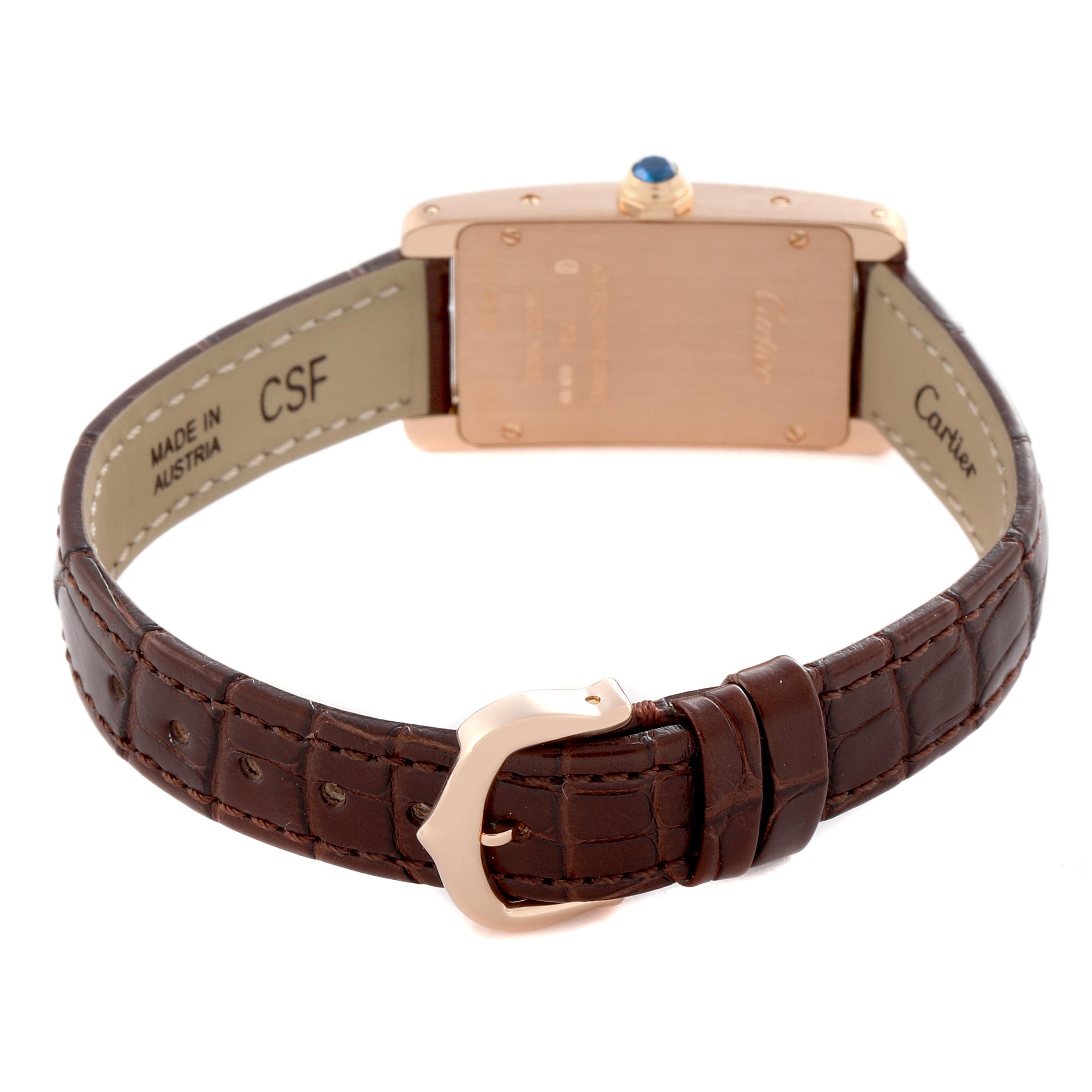 The image shows the back of a Cartier Tank Americaine W2607456 Women's Rose Gold Silver Dial W2607456 Women's Rose Gold Silver Dial watch, highlighting the case back, leather strap, and buckle.