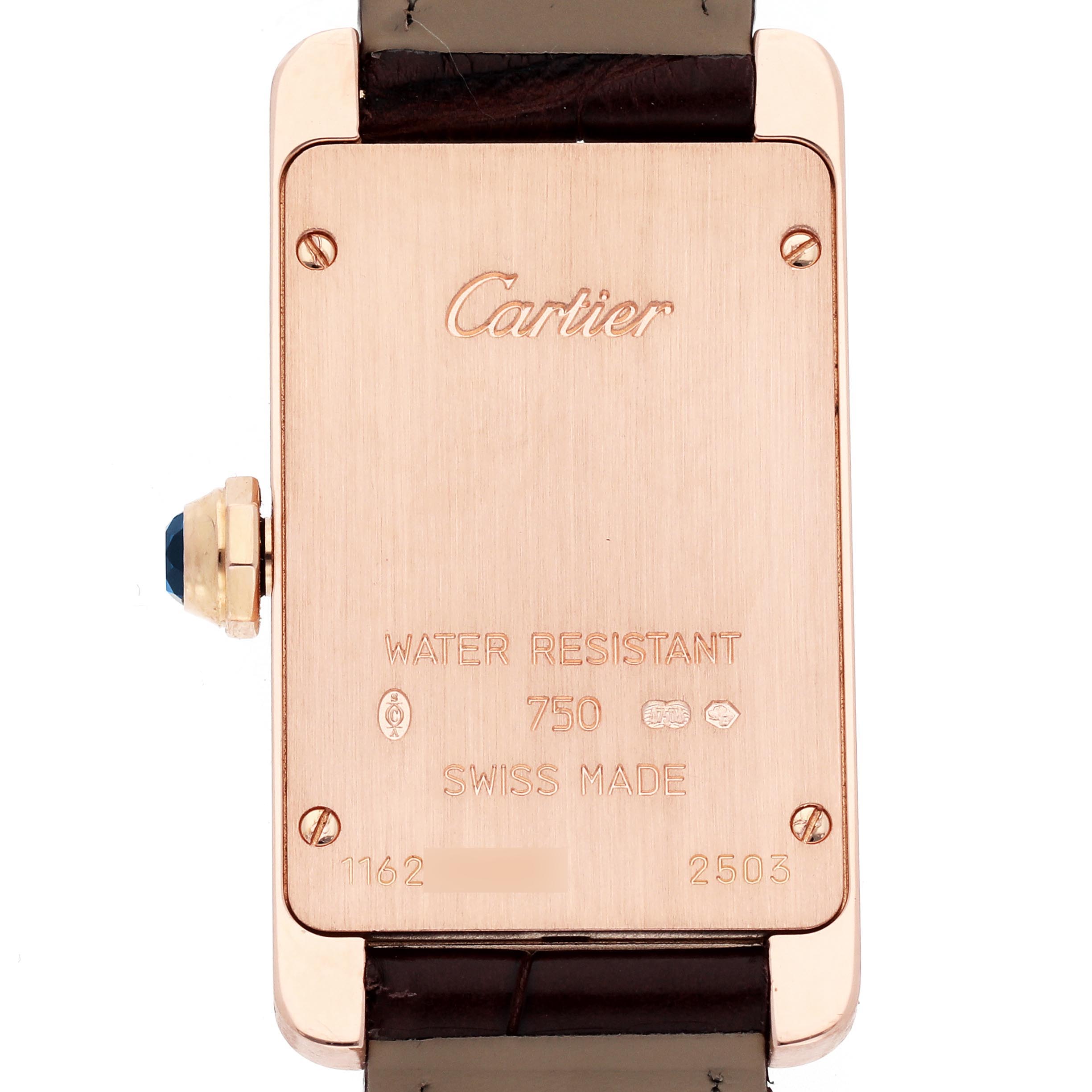 The image shows the back view of a Cartier Tank Americaine W2607456 Women's Rose Gold Silver Dial W2607456 Women's Rose Gold Silver Dial watch, highlighting its metal case with engravings and a visible crown.