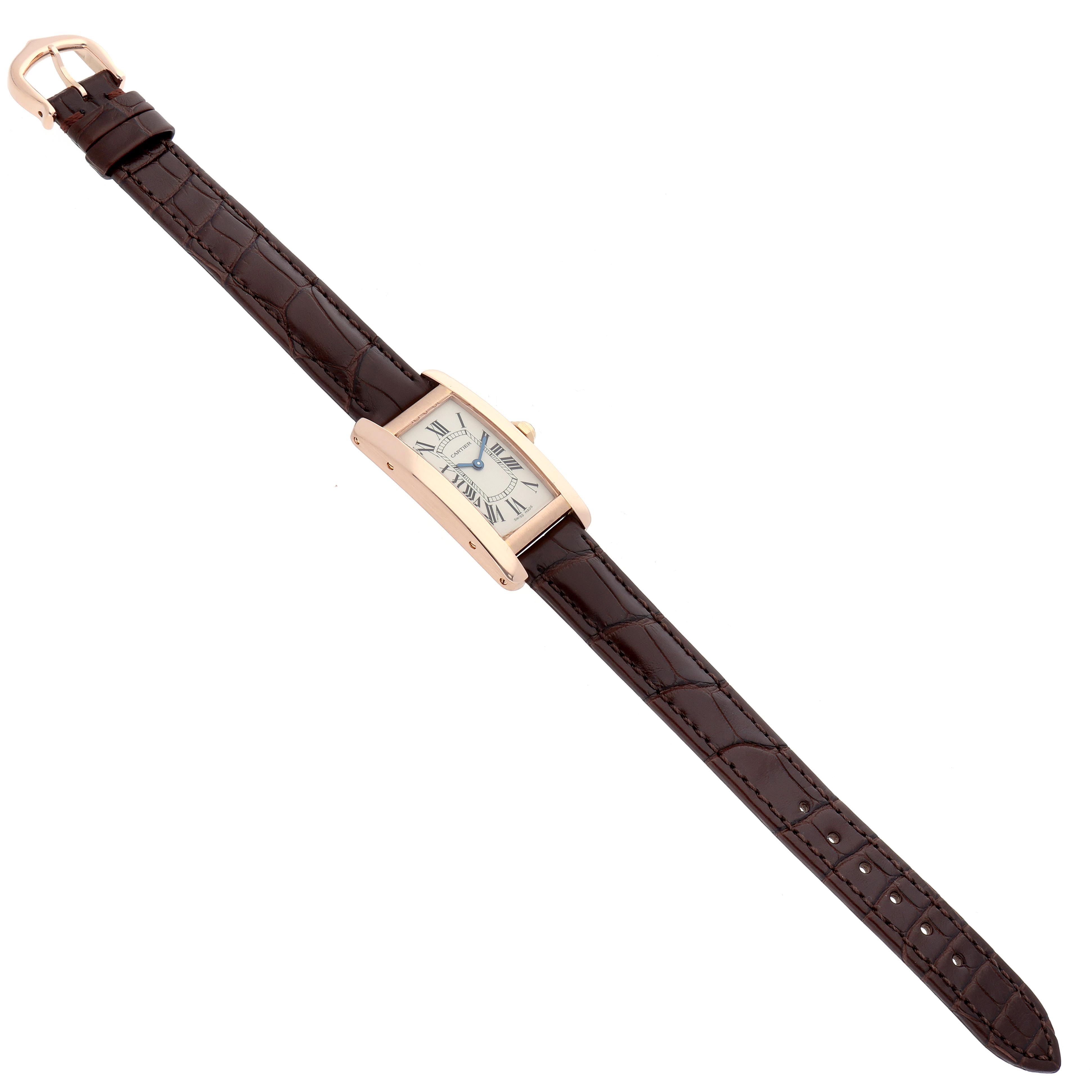 The Cartier Tank Americaine W2607456 Women's Rose Gold Silver Dial W2607456 Women's Rose Gold Silver Dial watch is shown at a slight angle, highlighting its rectangular case and leather strap.