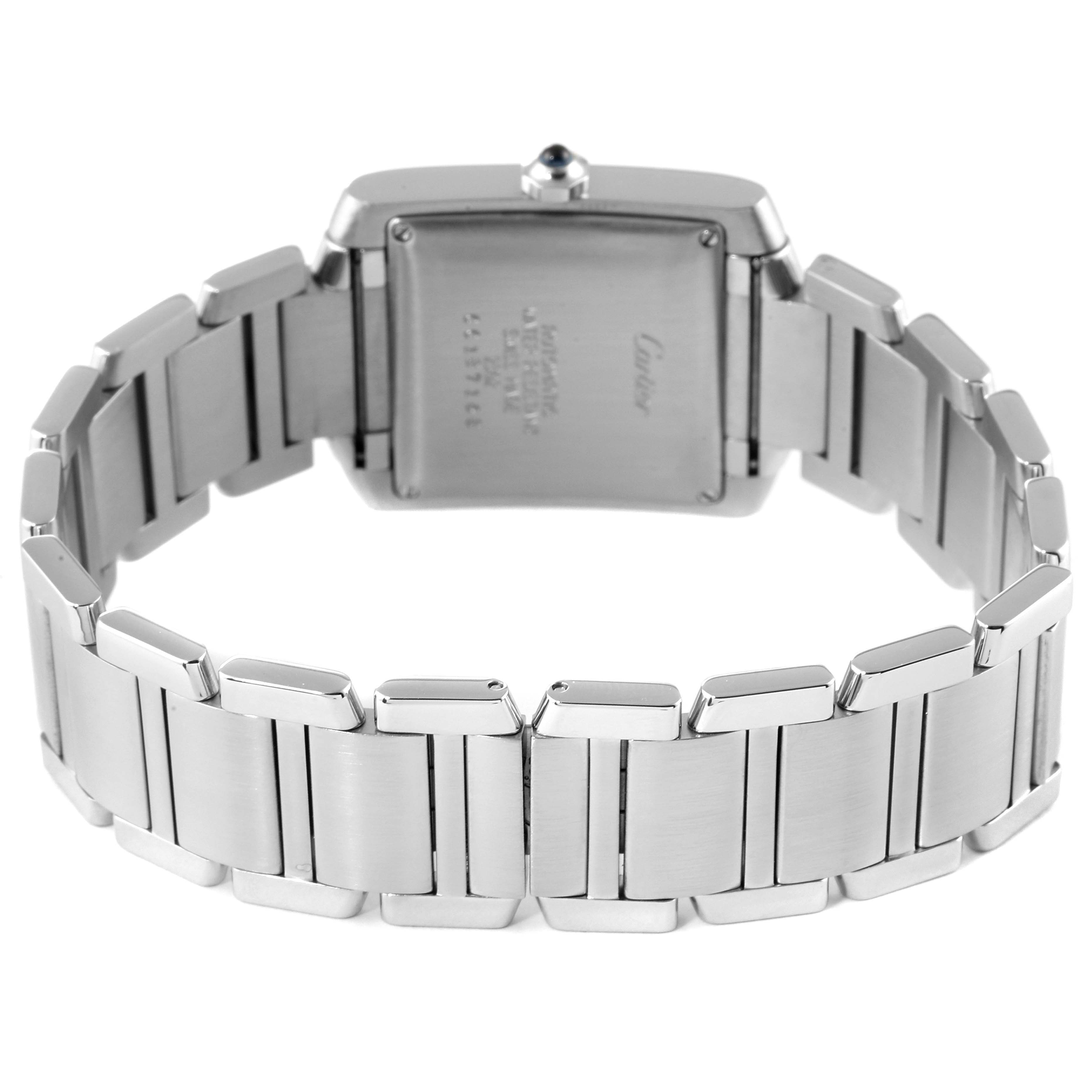 The image shows the back view of a Cartier Tank Francaise W51002Q3 Men's Stainless Steel Silver Dial W51002Q3 Men's Stainless Steel Silver Dial watch with a metal bracelet and visible case back.