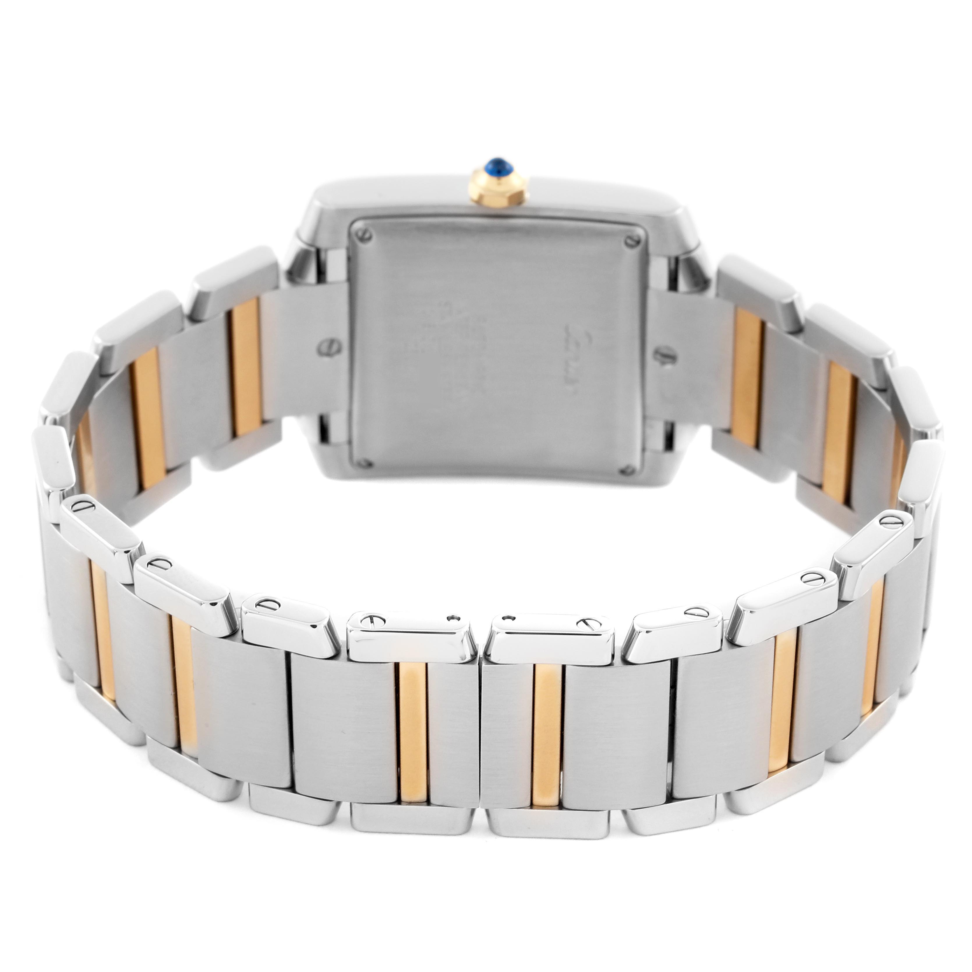 The Cartier Tank Française watch is shown from the back, highlighting its bracelet and case-back with two-tone links.