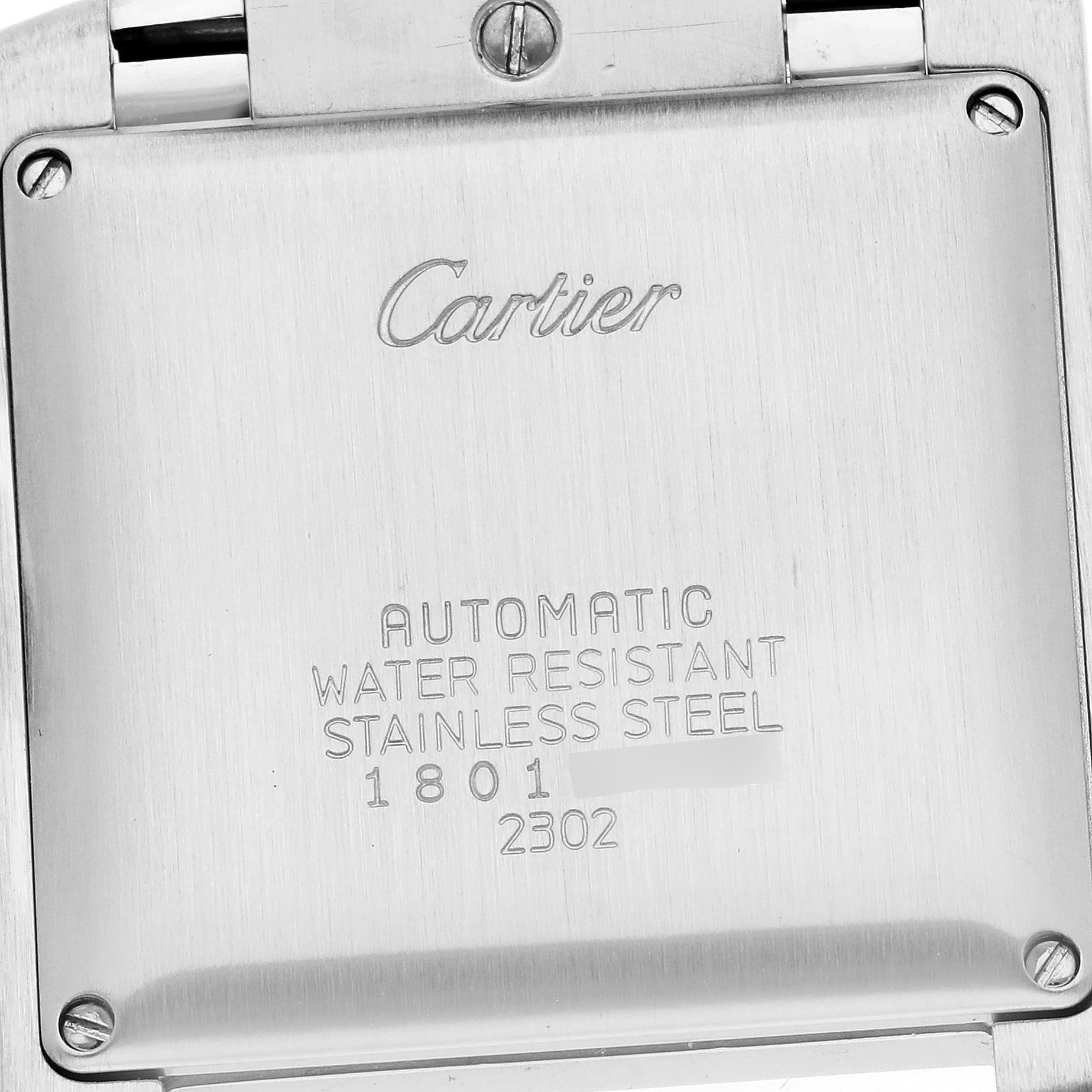 The image shows the back case of a Cartier Tank Française watch, highlighting its markings and material.