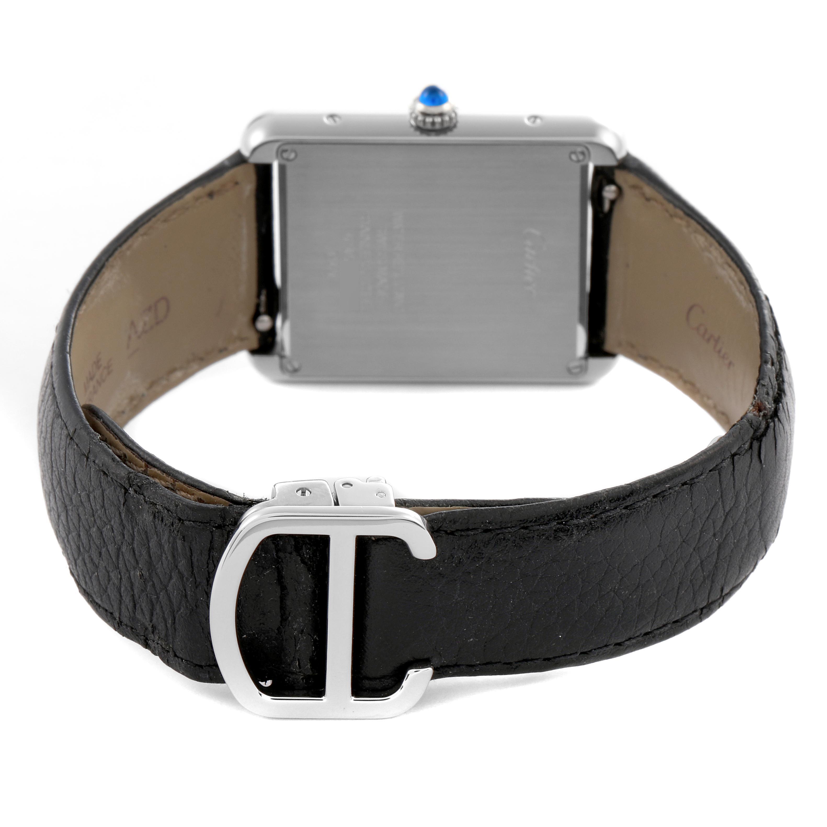 The image shows the back and clasp of the Cartier Tank Solo WSTA0028 Men's Stainless Steel Silver Dial WSTA0028 Men's Stainless Steel Silver Dial watch, featuring a black leather strap and a silver buckle.