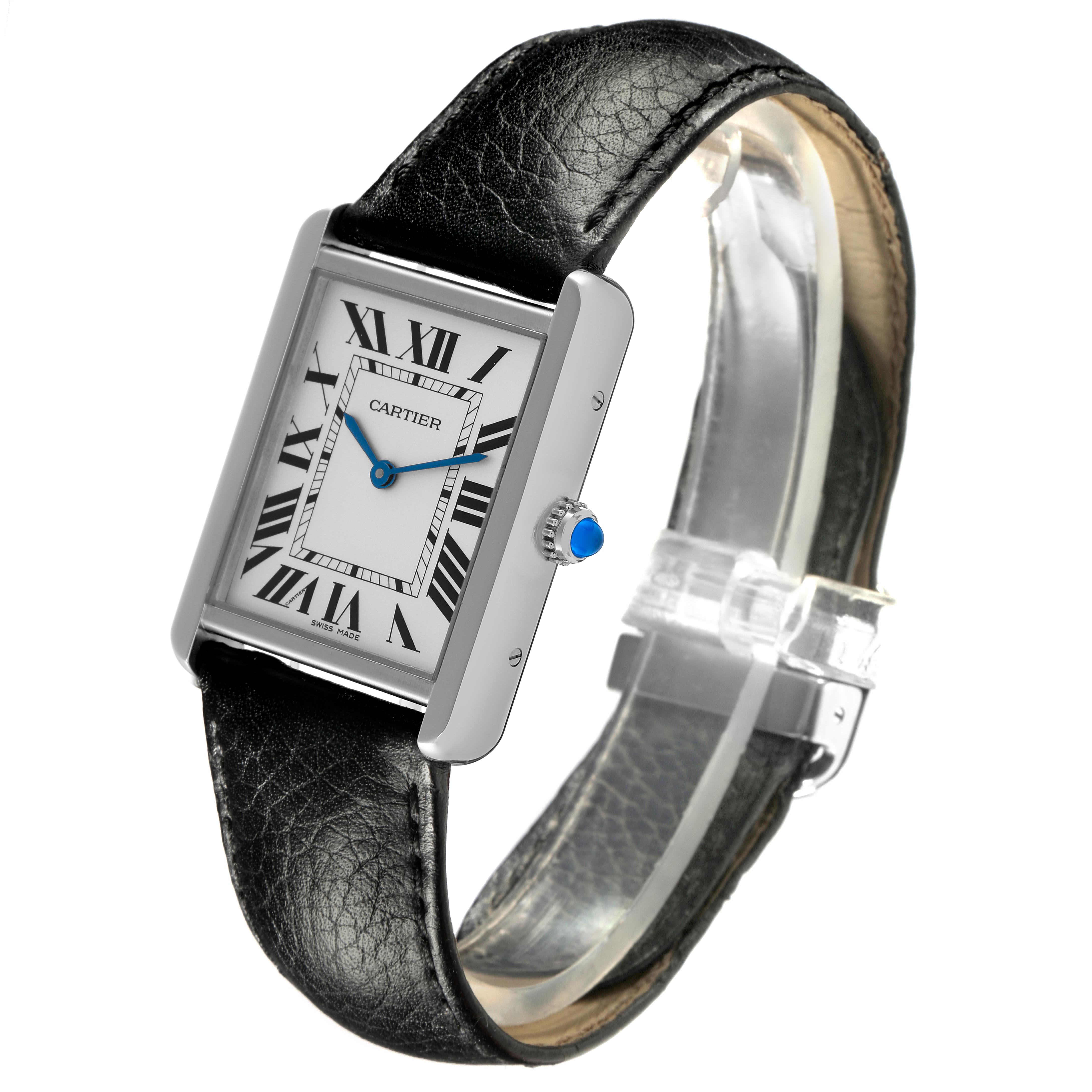 The Cartier Tank Solo WSTA0028 Men's Stainless Steel Silver Dial WSTA0028 Men's Stainless Steel Silver Dial watch is displayed at a three-quarter angle, showing the face, black leather strap, and blue cabochon crown.