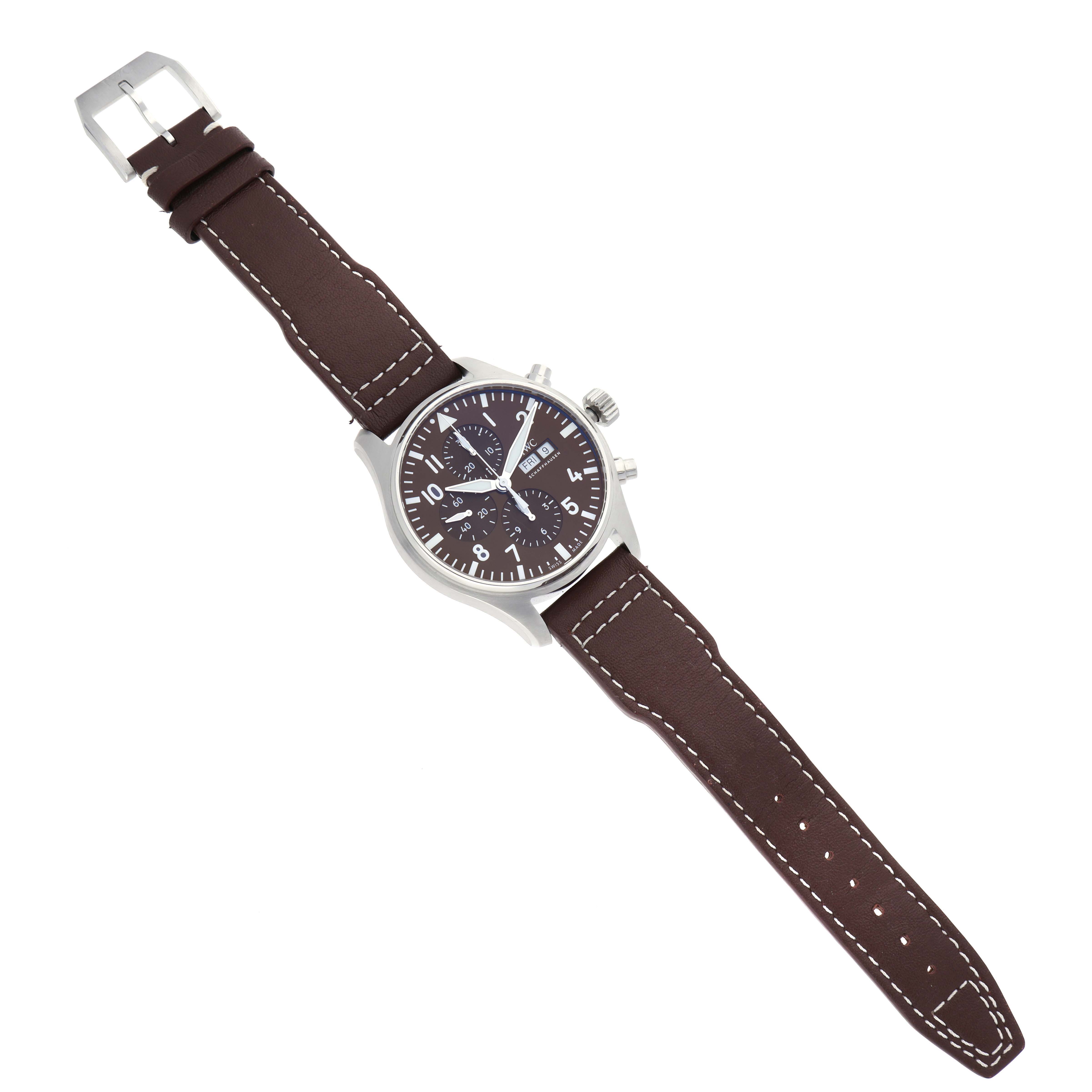 The IWC Pilot IW377713 Men's Stainless Steel Brown Dial IW377713 Men's Stainless Steel Brown Dial watch model is shown at an angled top view, displaying the dial, case, crown, pushers, and full leather strap.