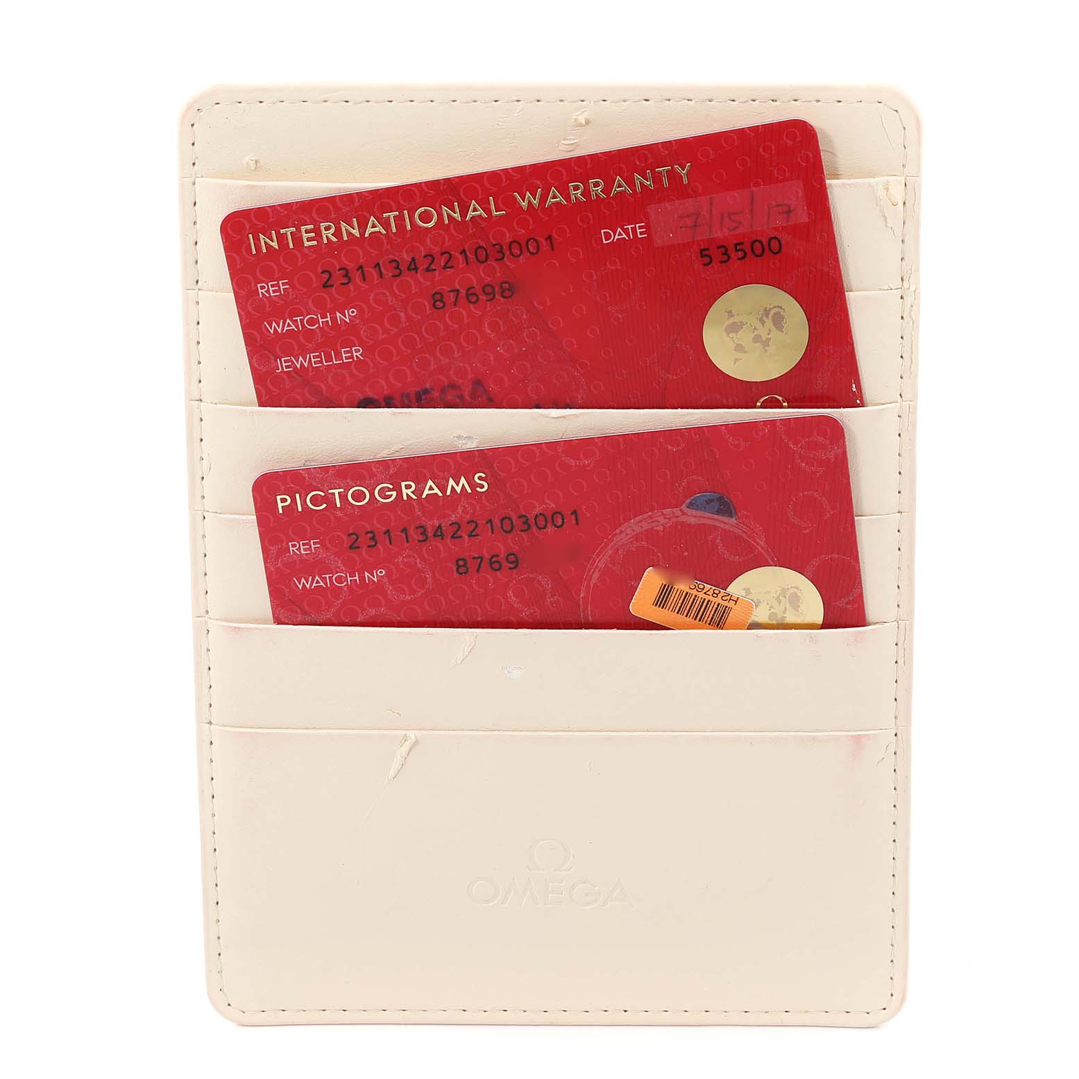 The image shows the international warranty and pictogram cards for an Omega Aqua Terra 231.13.42.21.03.001 Men
s Stainless Steel Blue Dial 231.13.42.21.03.001 Men
s Stainless Steel Blue Dial watch, inside a beige cardholder.