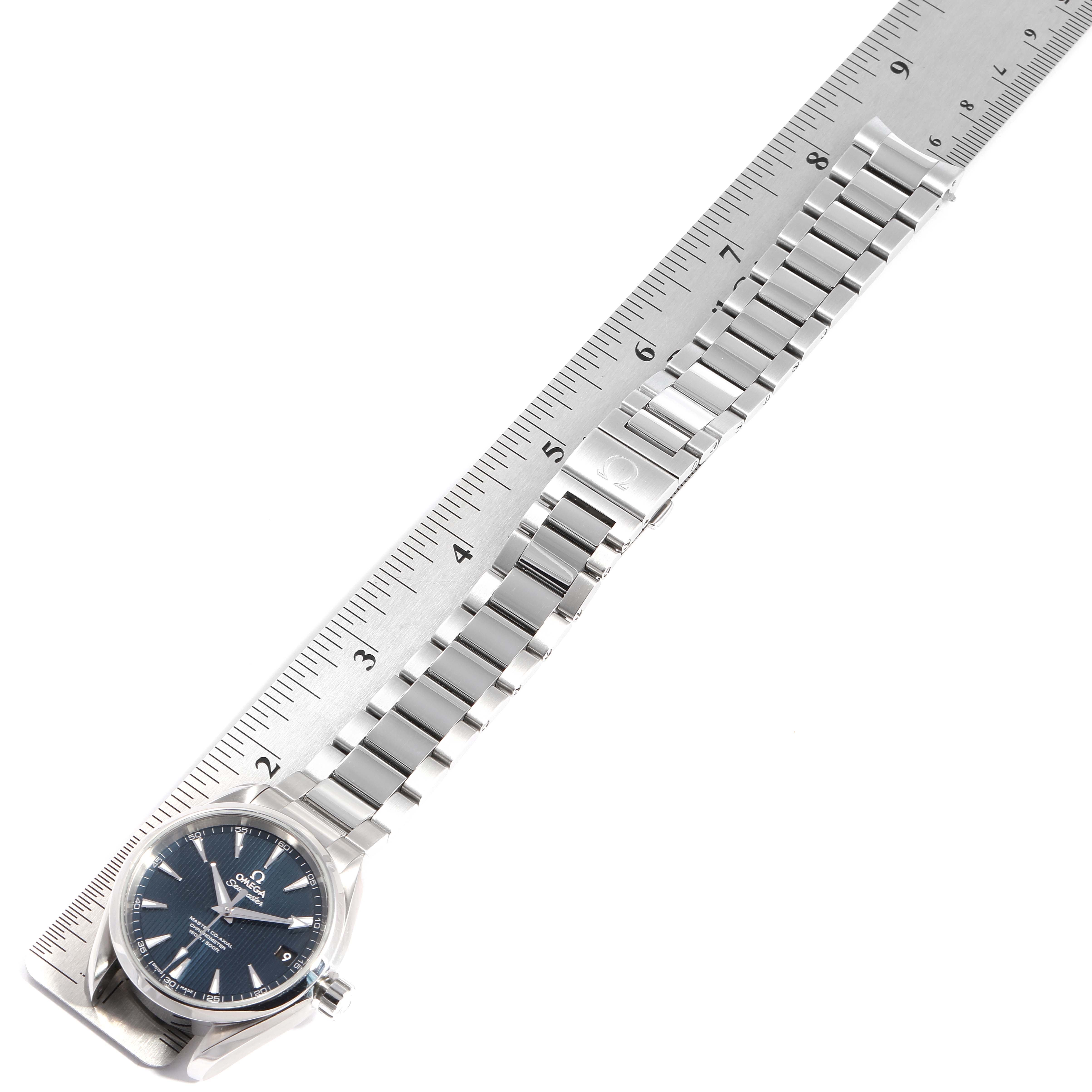 The Omega Aqua Terra 231.10.39.21.03.002 Men
s Stainless Steel Blue Dial 231.10.39.21.03.002 Men
s Stainless Steel Blue Dial watch is displayed flat with the entire strap and face visible alongside a ruler for scale.
