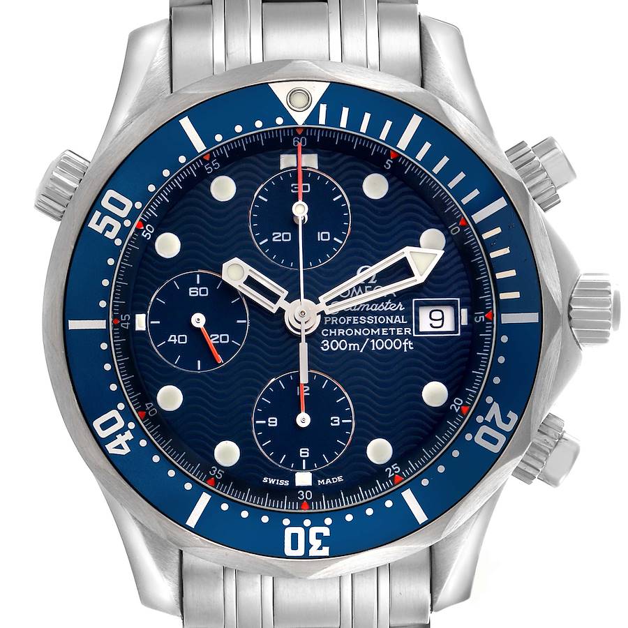 The Omega Seamaster watch is shown from a frontal angle, displaying its blue dial, bezel, chronograph subdials, and stainless steel bracelet.