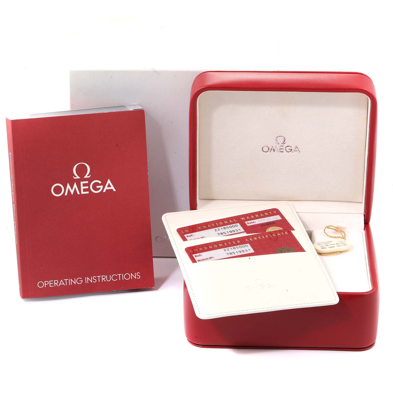 This image shows an Omega Planet Ocean 2218.50.00 Men
s Stainless Steel Black Dial 2218.50.00 Men
s Stainless Steel Black Dial watch box, warranty cards, and operating instructions from a straight-on angle.