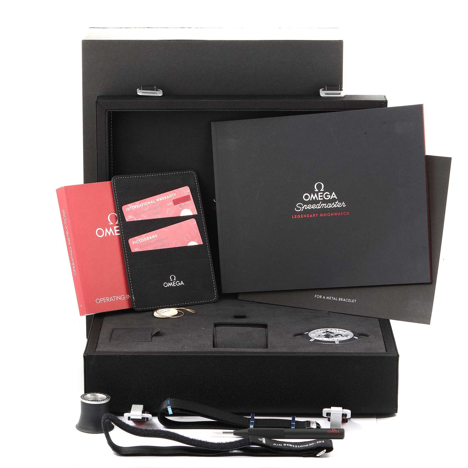 The image shows a top-down view of an Omega Speedmaster 311.30.42.30.01.005 Men
s Stainless Steel Black Dial 311.30.42.30.01.005 Men
s Stainless Steel Black Dial watch box set with manuals, warranty cards, and accessories.