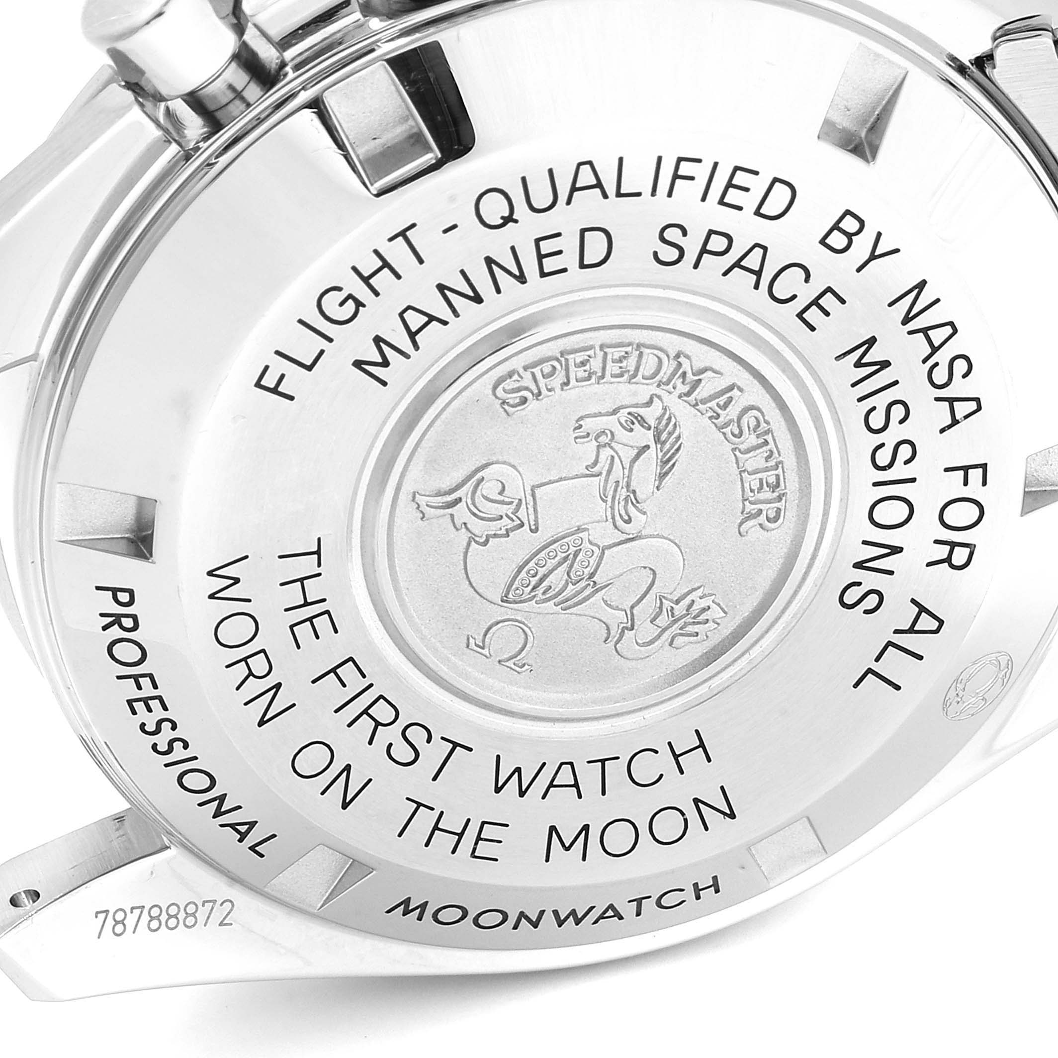 This image shows the back case of an Omega Speedmaster 311.30.42.30.01.005 Men
s Stainless Steel Black Dial 311.30.42.30.01.005 Men
s Stainless Steel Black Dial, displaying engravings related to its space mission qualifications.