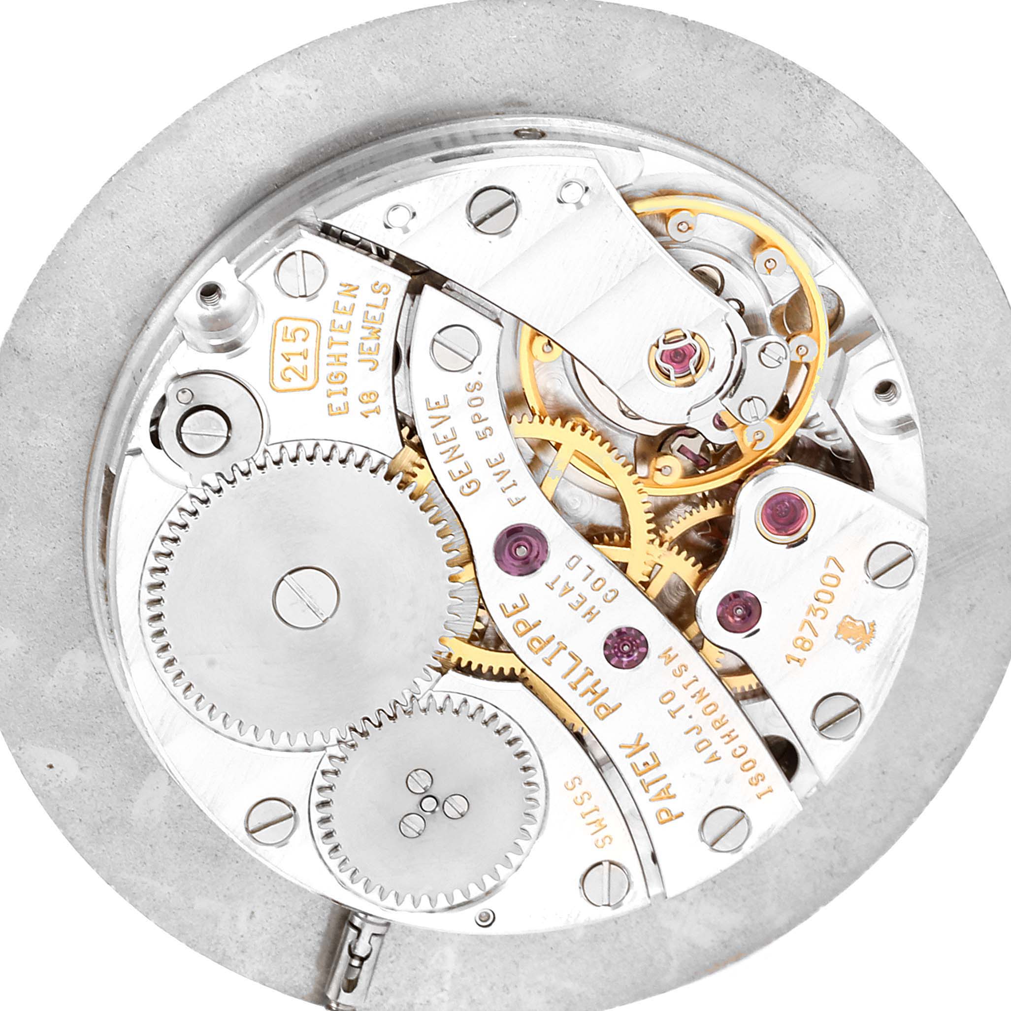 This is a close-up view of the intricate movement and gears of the Calatrava model by Patek Philippe.