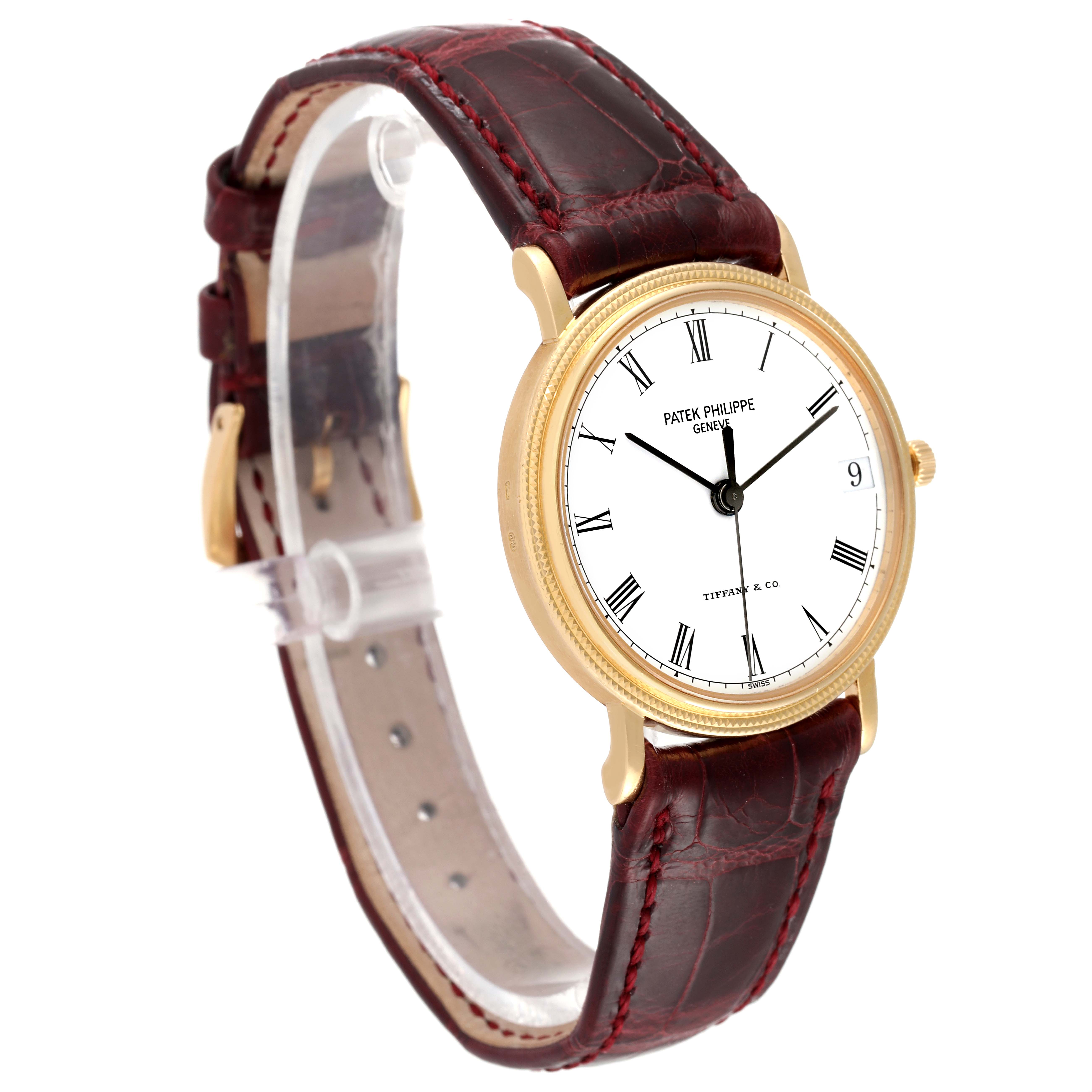 The image shows a side angle view of a Patek Philippe Calatrava 3802G Men's Yellow Gold White Dial 3802G Men's Yellow Gold White Dial watch, highlighting its face, strap, and gold casing.