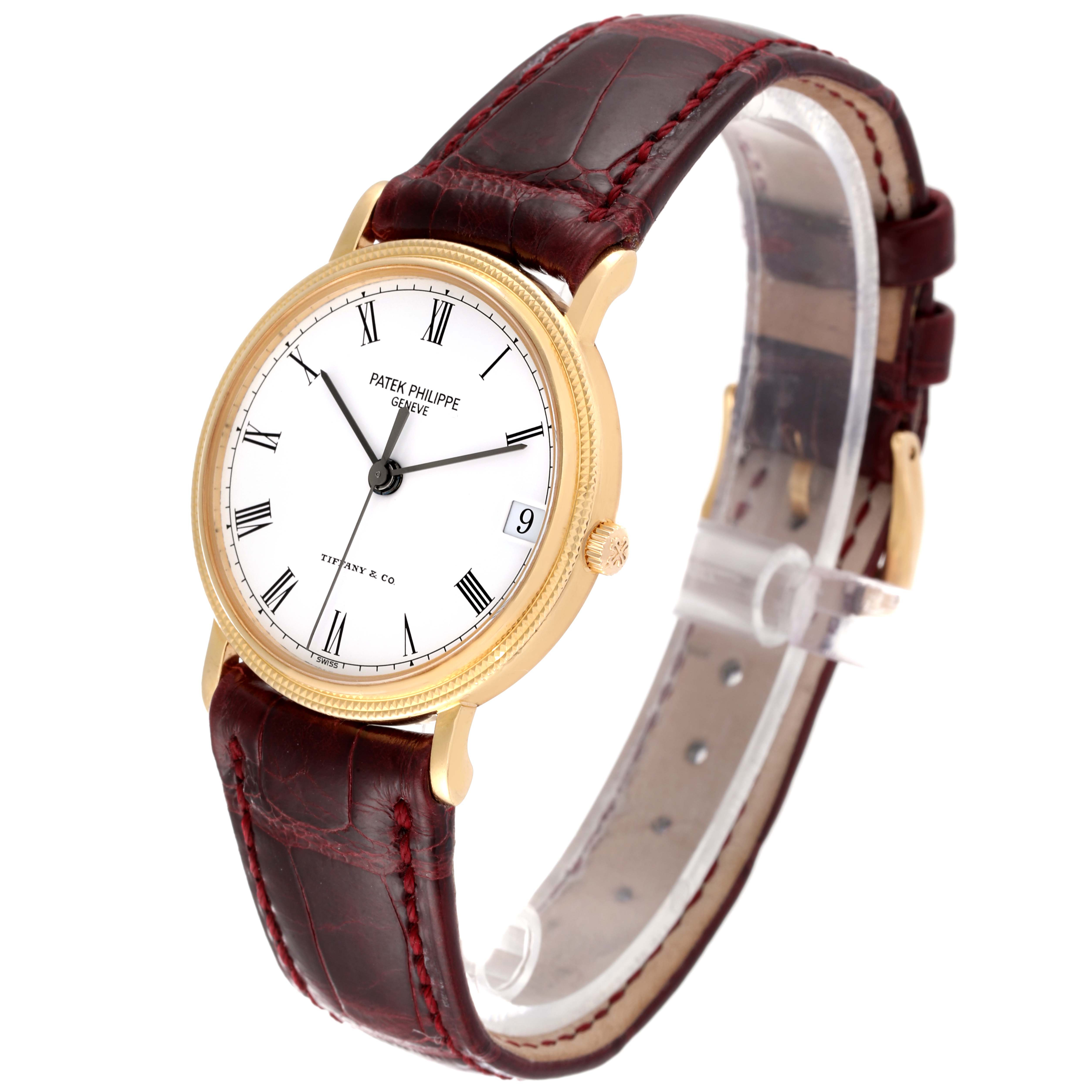 The image shows a side angle of the Patek Philippe Calatrava 3802G Men's Yellow Gold White Dial 3802G Men's Yellow Gold White Dial watch, highlighting its dial, bezel, and leather strap.