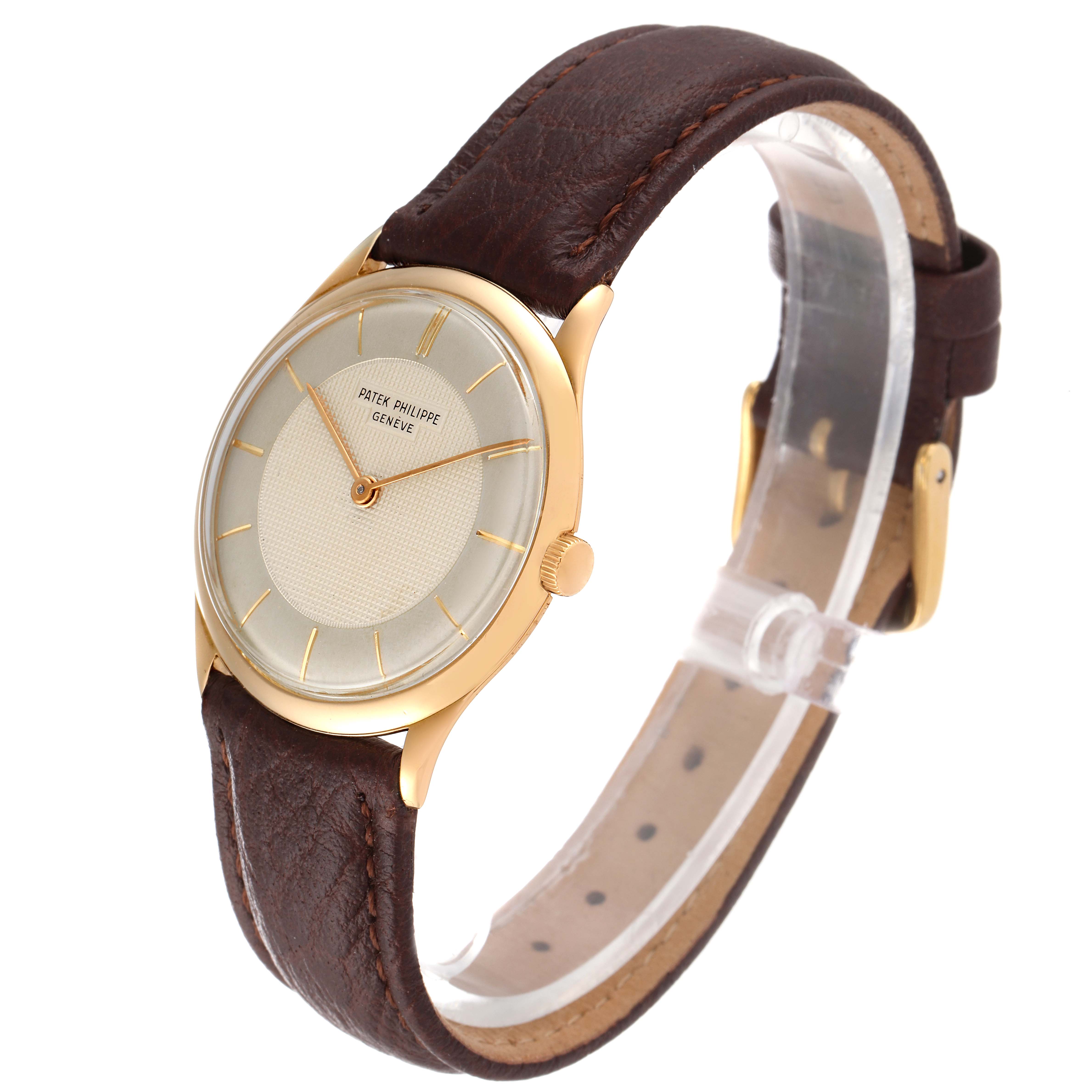 This image displays a Patek Philippe Calatrava 2507 Men's Yellow Gold Silver Dial 2507 Men's Yellow Gold Silver Dial watch, highlighting its face, leather strap, and clasp from a side angle.