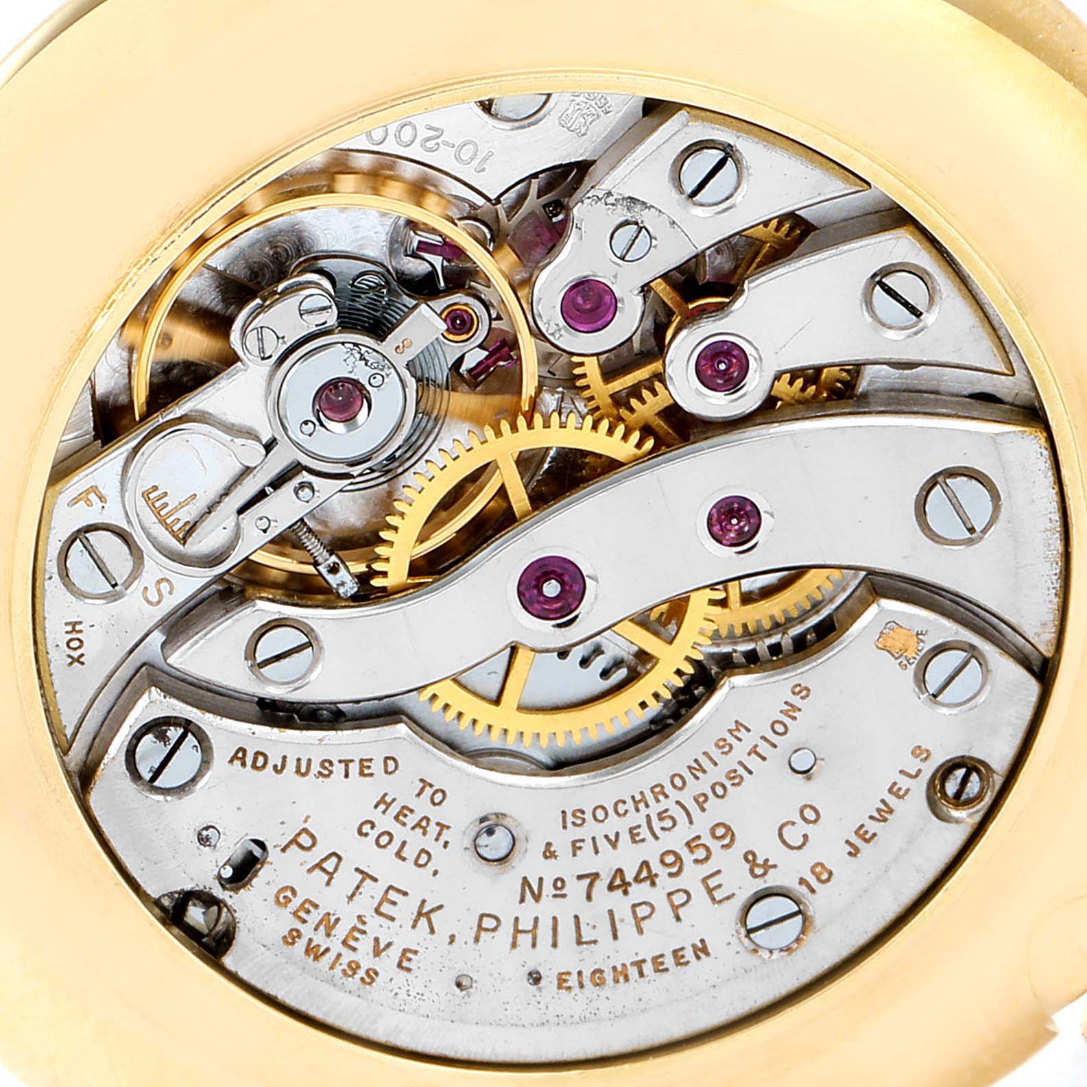The image shows a close-up view of the movement and intricate components of a Patek Philippe Calatrava 2507 Men's Yellow Gold Silver Dial 2507 Men's Yellow Gold Silver Dial watch.
