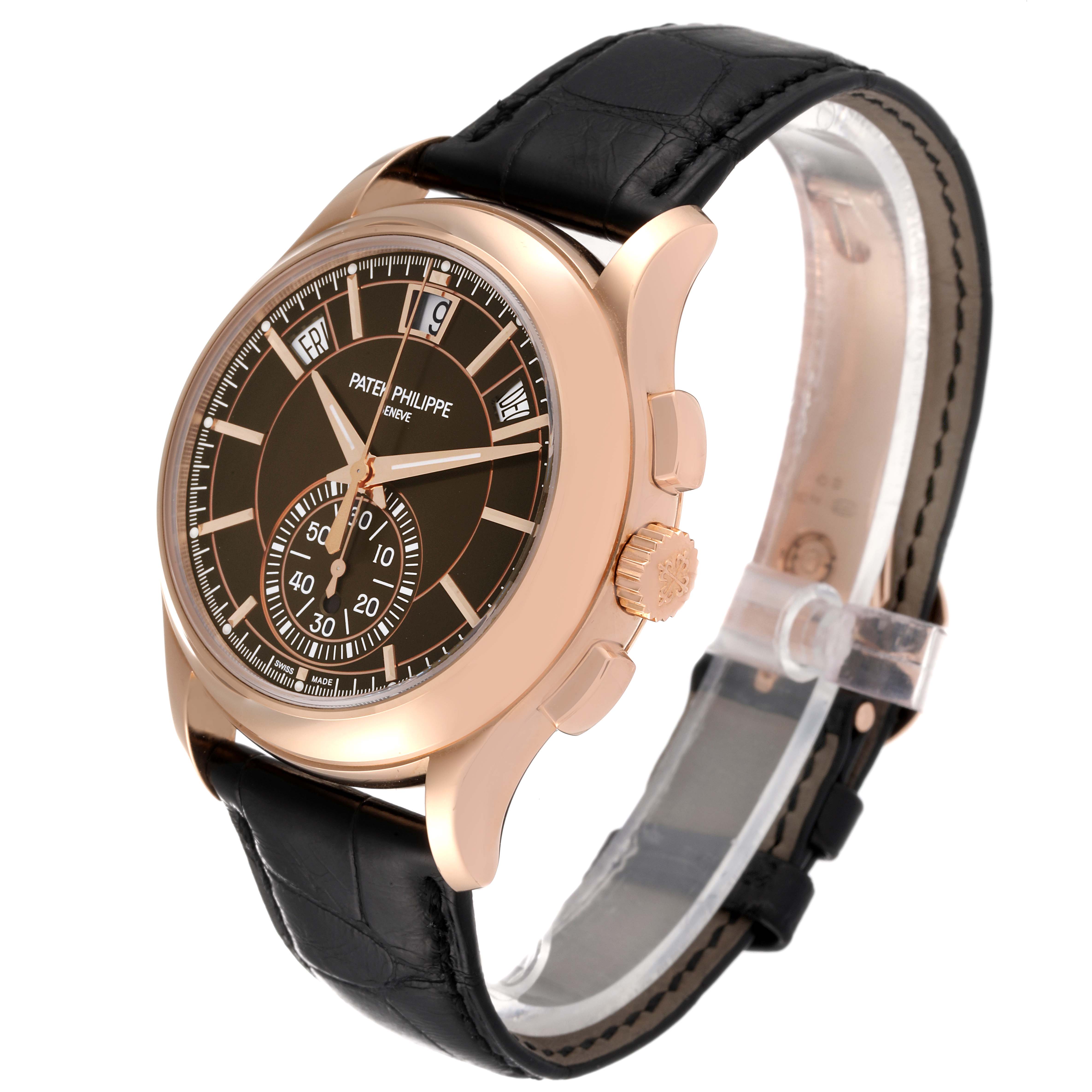 The Patek Philippe Complications 5905R - 001 Men's Rose Gold Brown Dial 5905R - 001 Men's Rose Gold Brown Dial watch is shown from a side-front angle, highlighting its dial, bezel, crown, and black leather strap.
