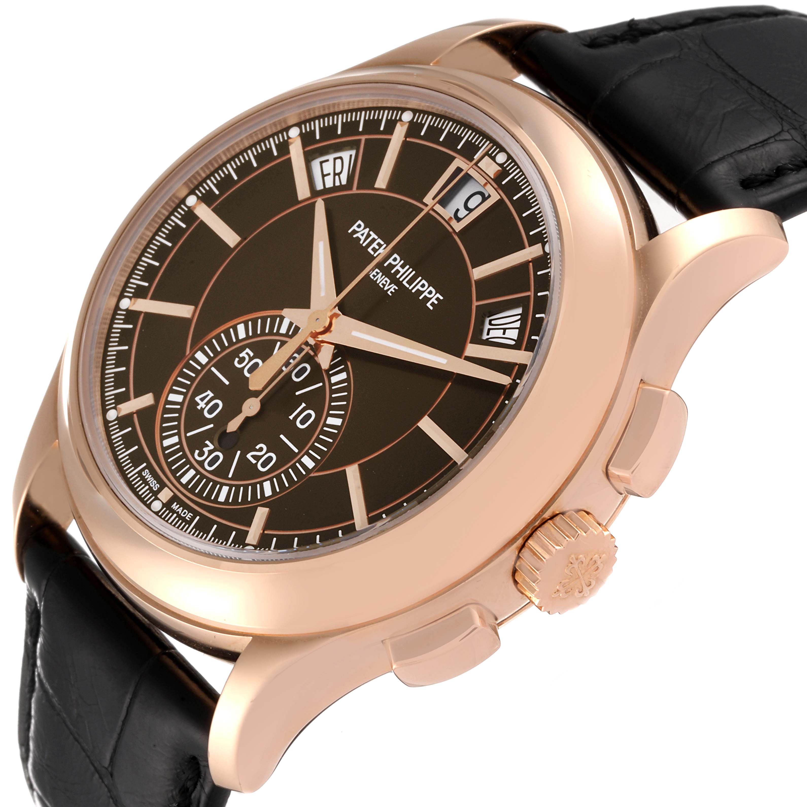 The image shows a side angle of a Patek Philippe Complications 5905R - 001 Men's Rose Gold Brown Dial 5905R - 001 Men's Rose Gold Brown Dial watch, highlighting the face, crown, and part of the bracelet.