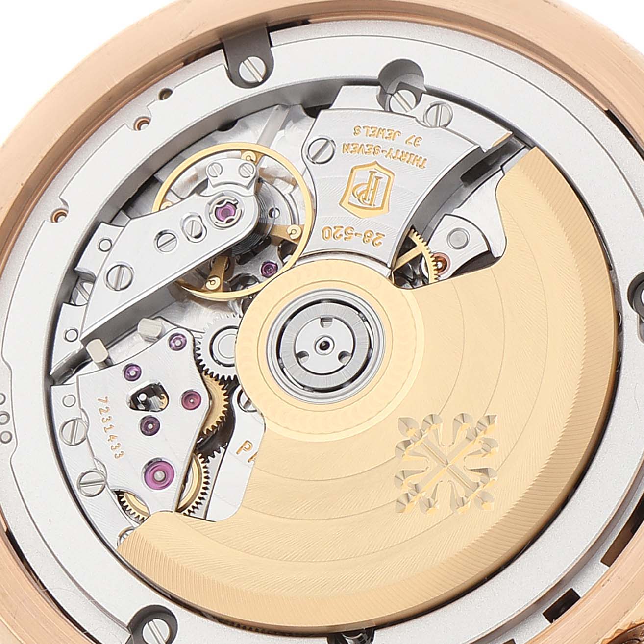 This image shows a close-up view of the intricate inner mechanism of a Patek Philippe Complications 5905R - 001 Men's Rose Gold Brown Dial 5905R - 001 Men's Rose Gold Brown Dial model watch.
